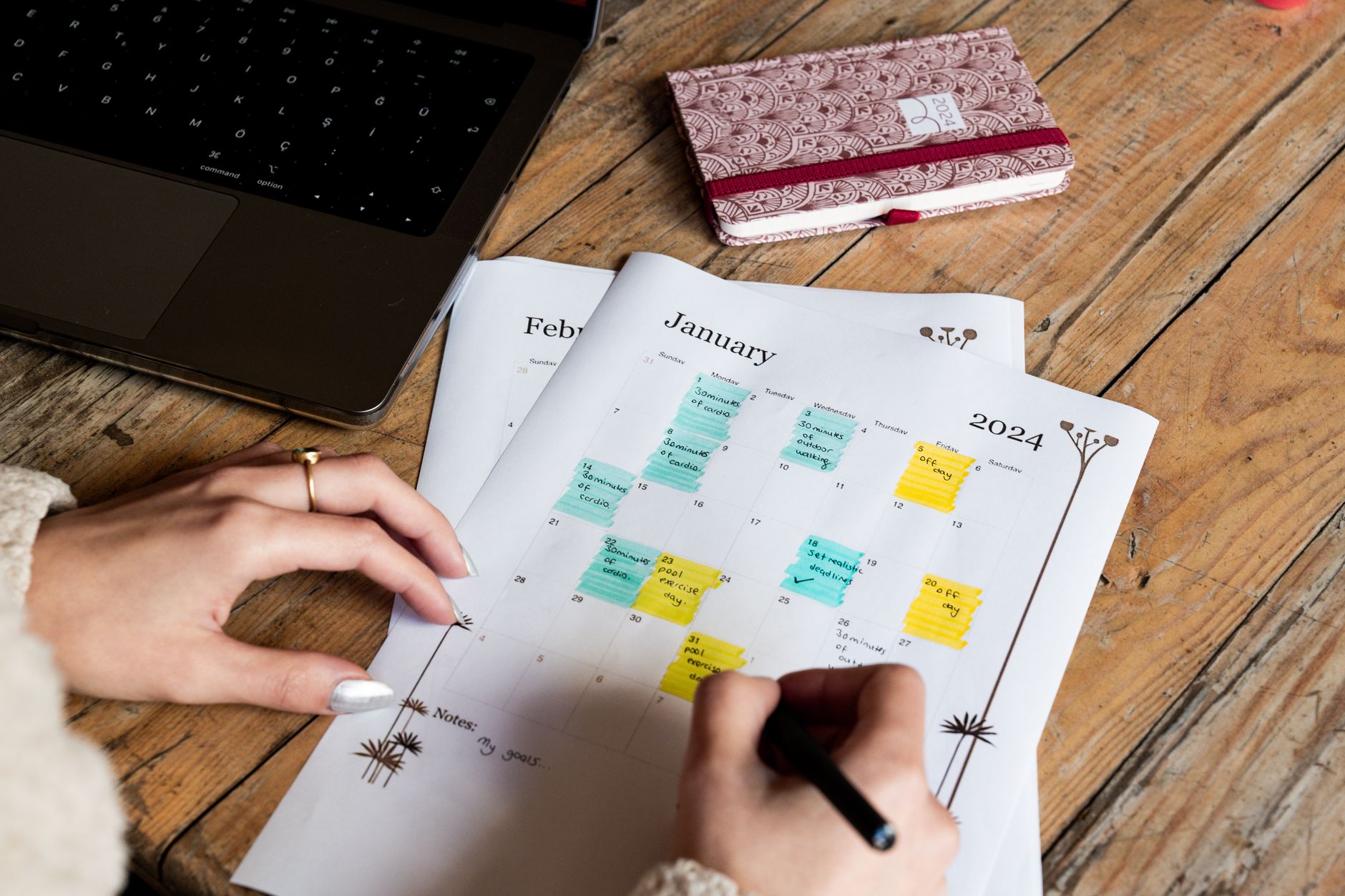 A consultant sketching out their annual marketing plan at their desk