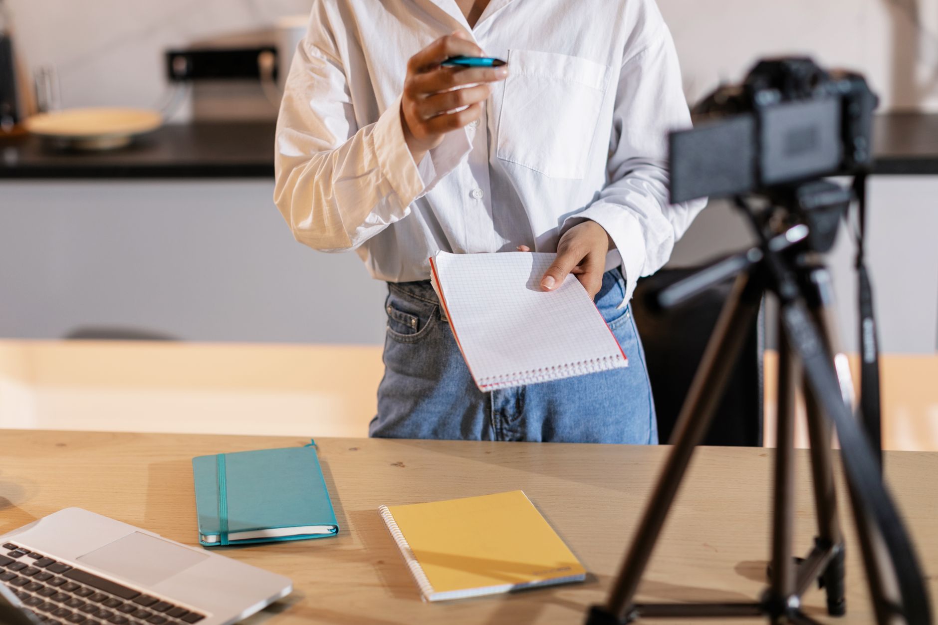 A course creator recording a lesson at their home desk