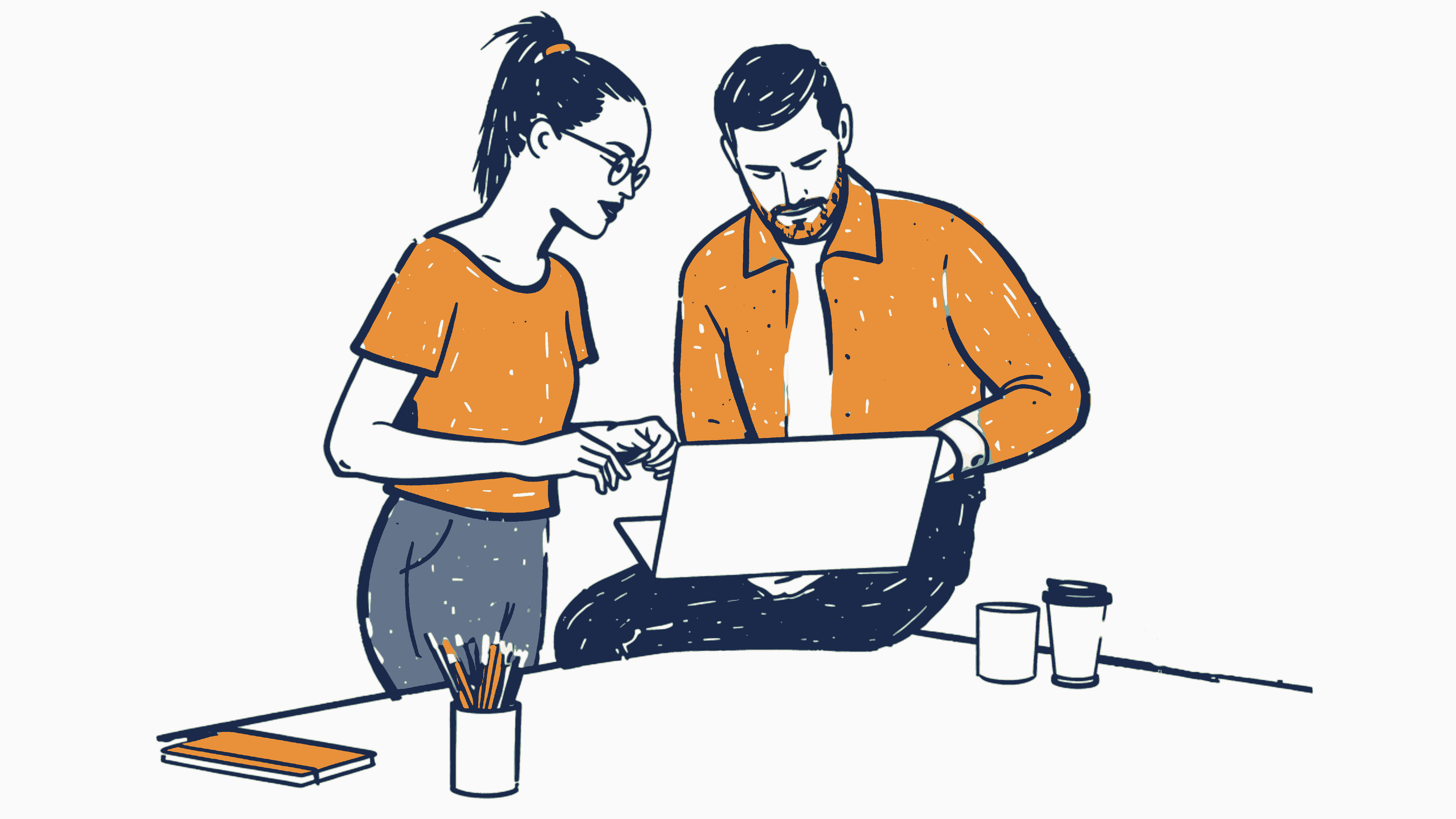 Two colleagues collaborating over a laptop at a desk.