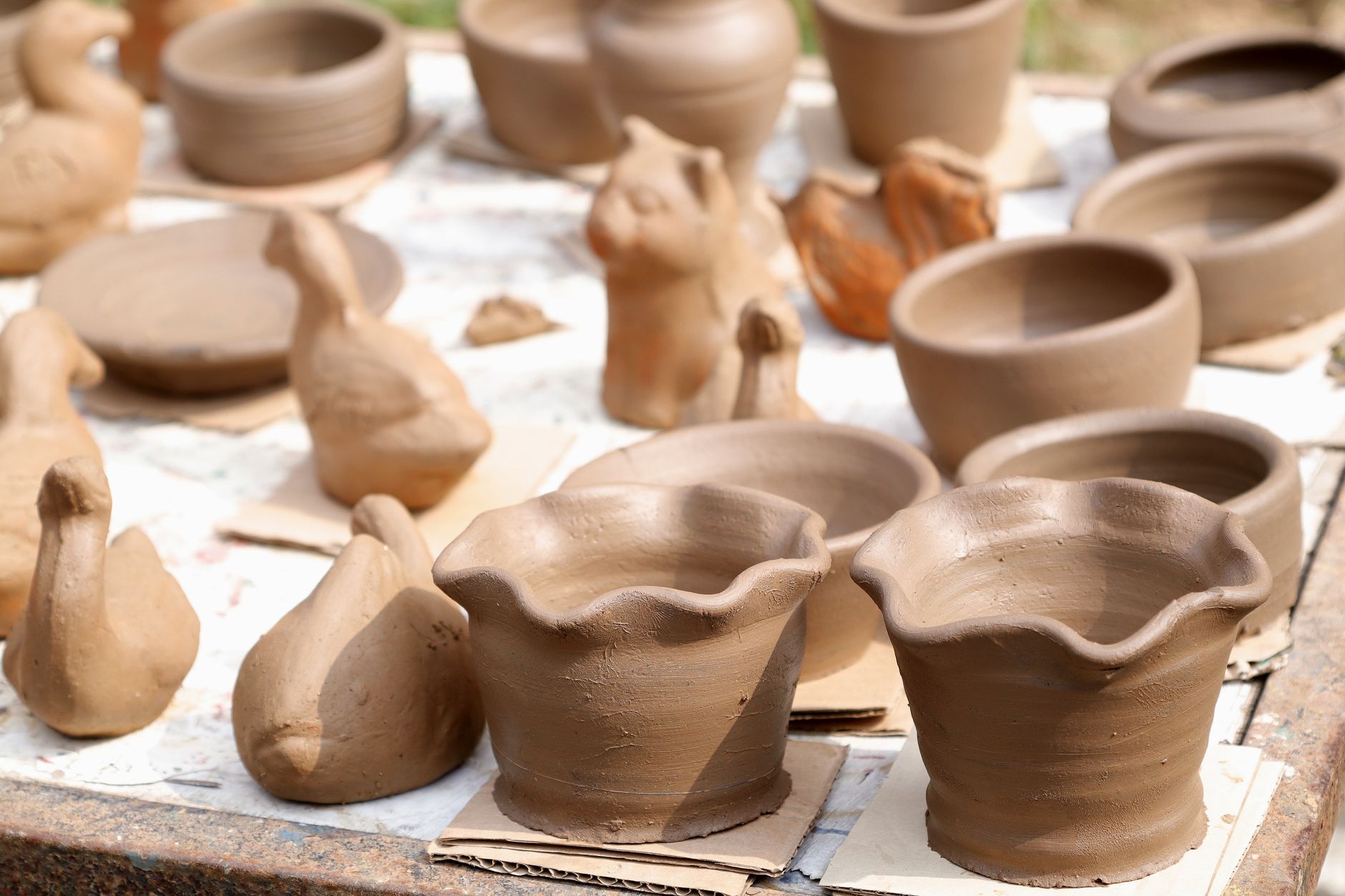 A potter photographing real work to use as proof on her site