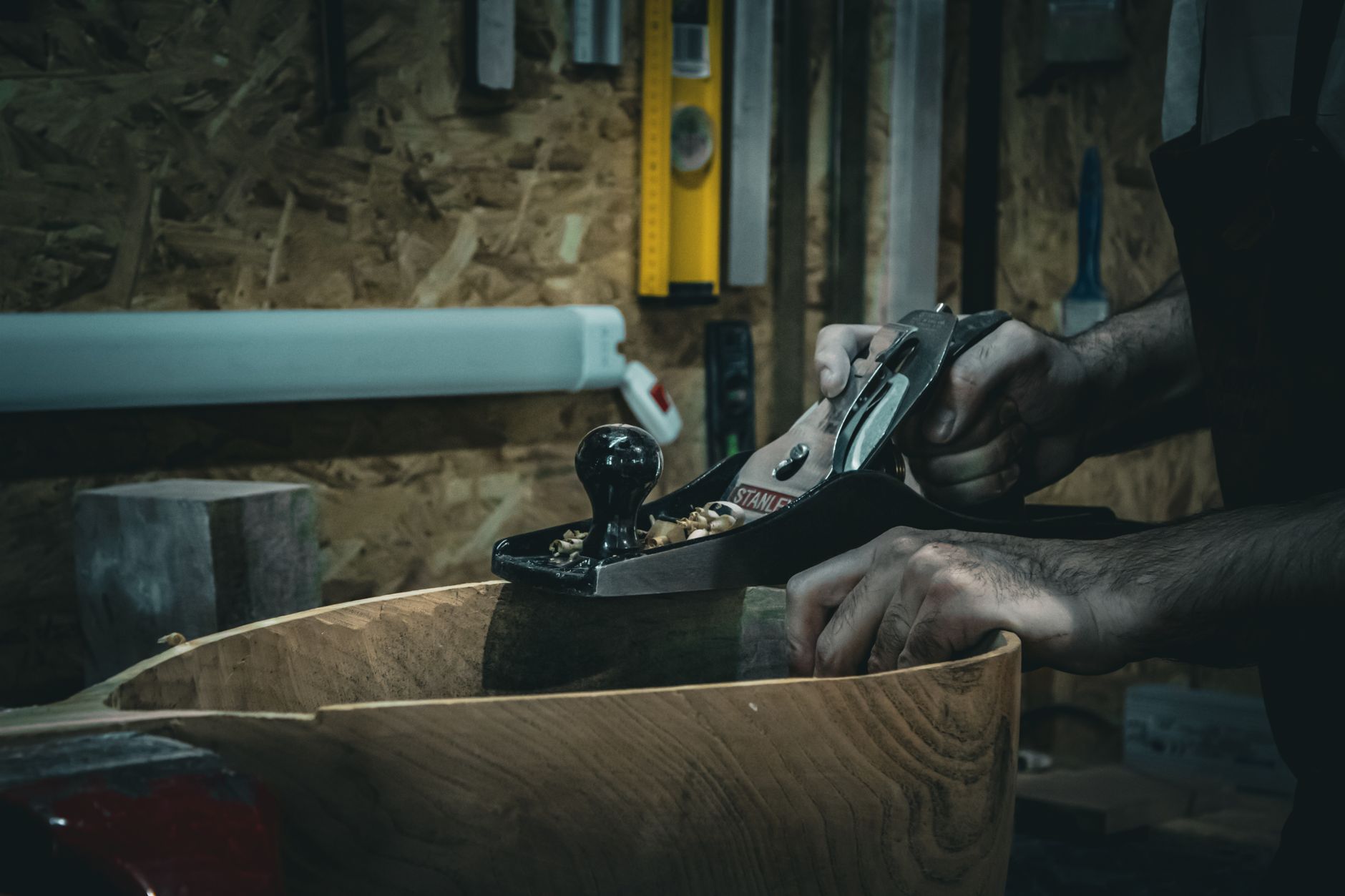 A woodworker sharing the story behind a piece with a customer