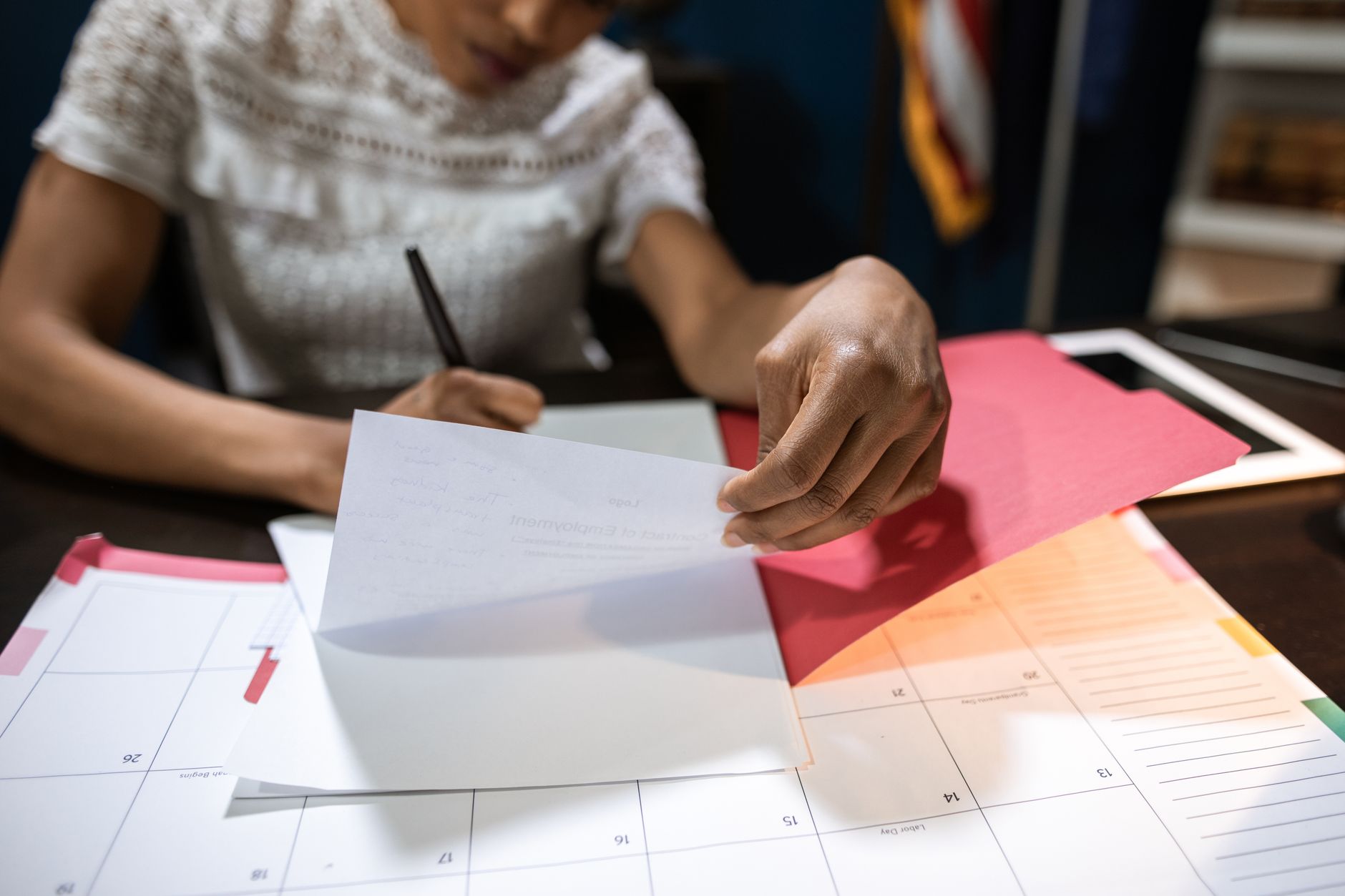 A business owner planning a daily reveal calendar on paper