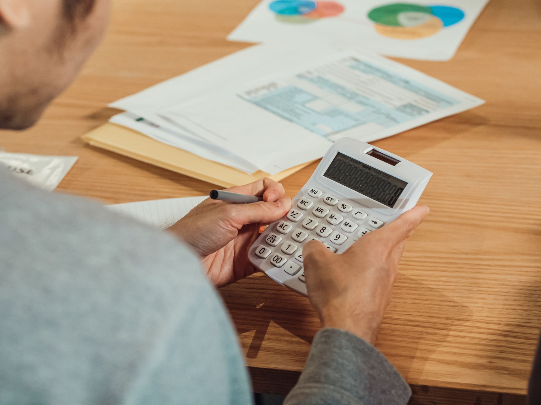 A shop owner calculating commission rates against their margins