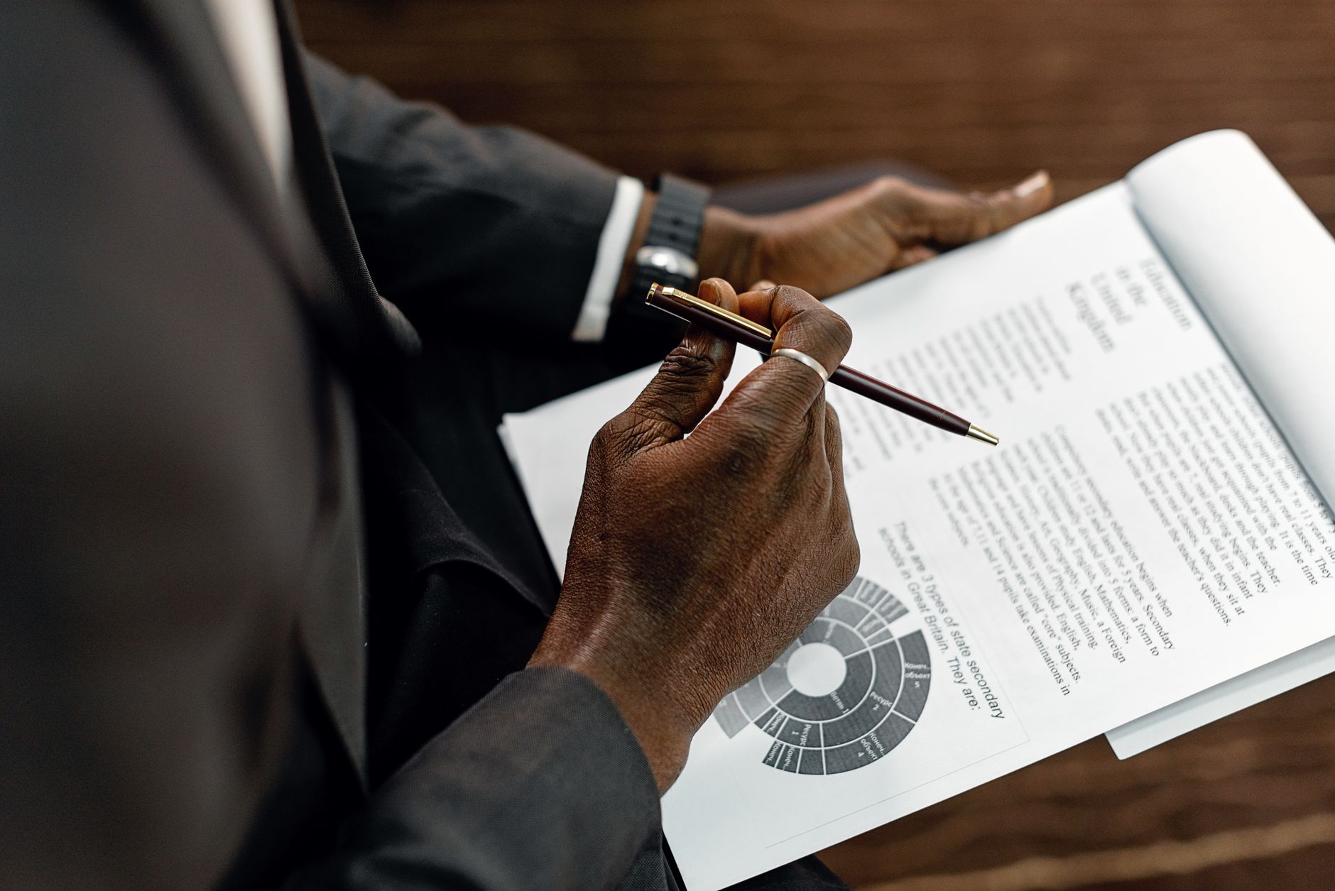 An owner reviewing a document carefully before it is sent out