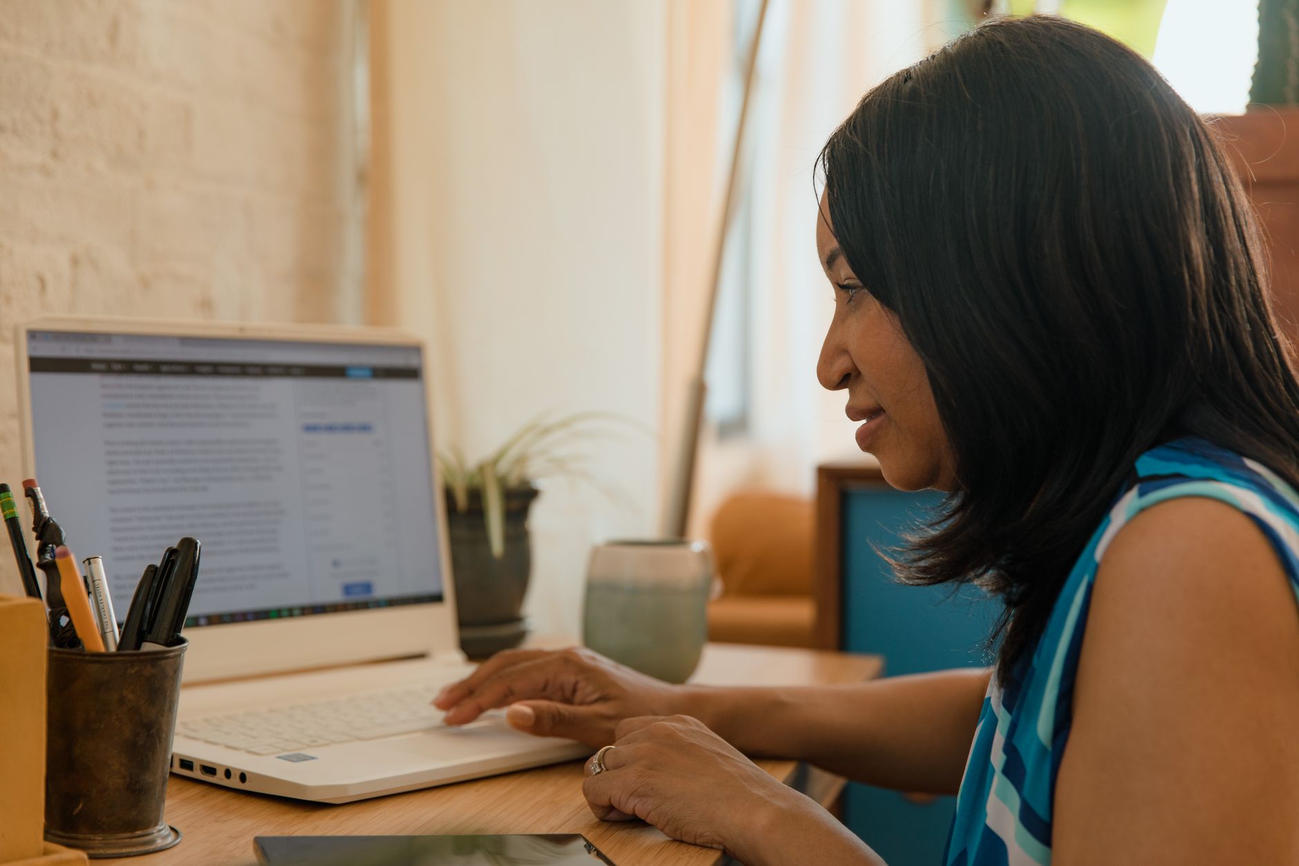 A small business owner drafting marketing copy at their desk