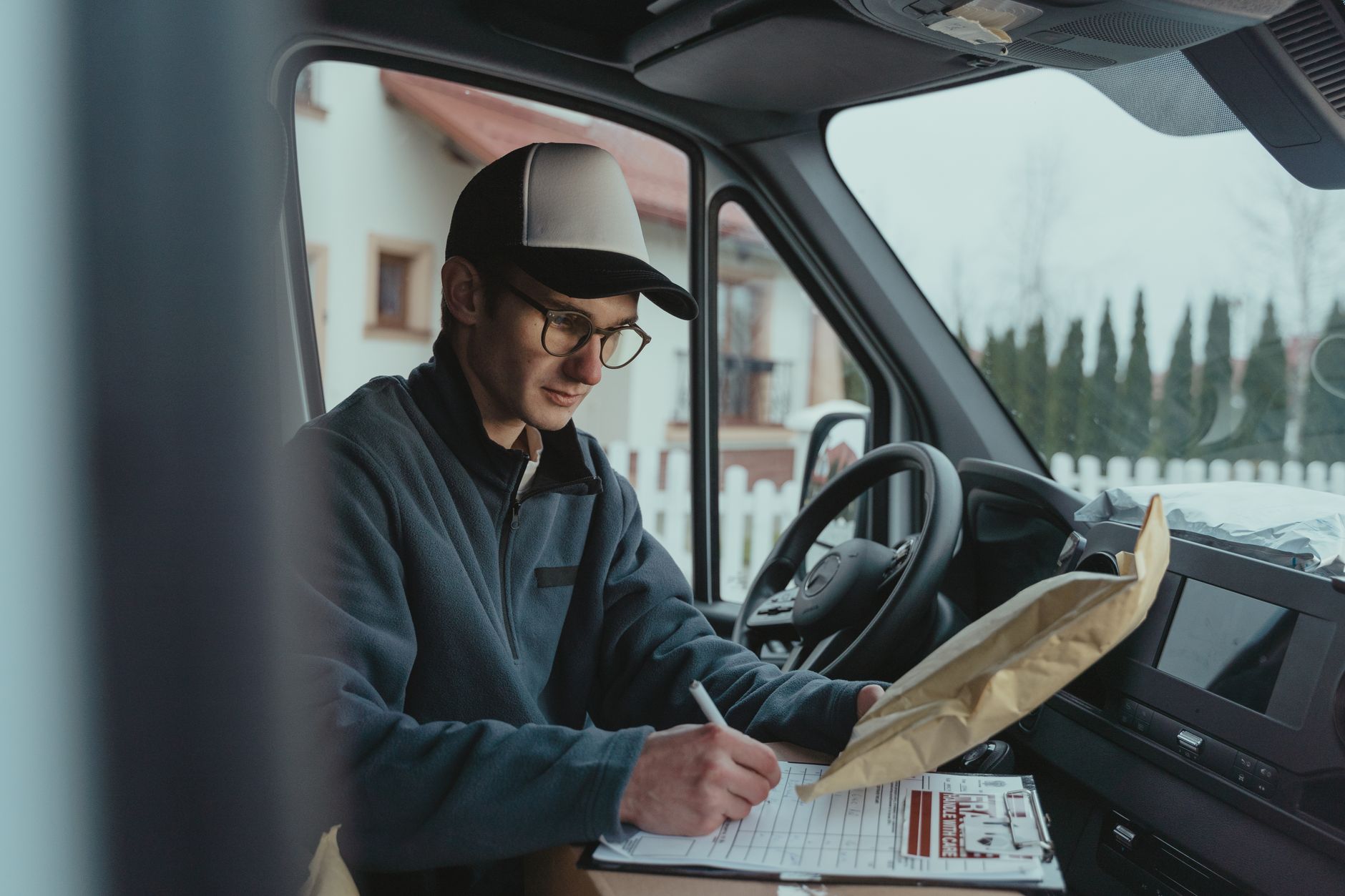 A customer receiving a parcel from a small online shop with a personal touch
