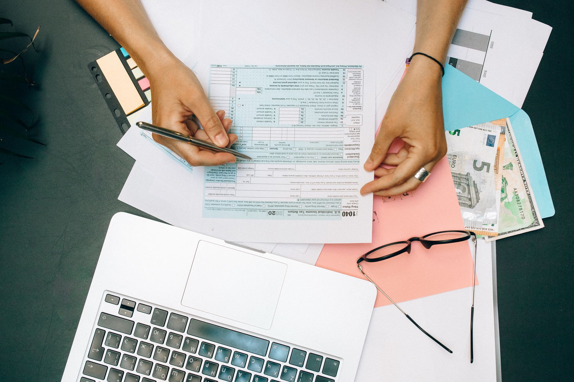 An accountant working through a client proposal at their desk