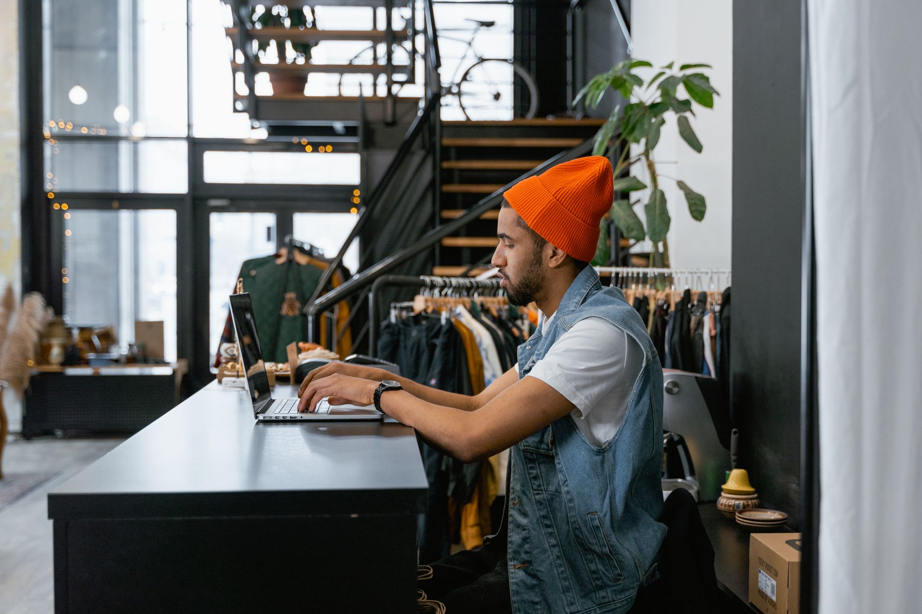 A shop owner drafting marketing content behind the counter