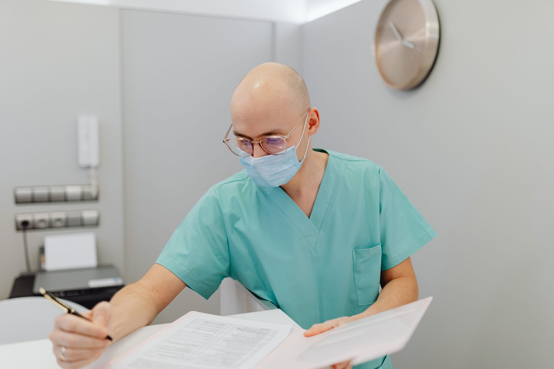 An osteopath drafting a newsletter after finishing patient appointments