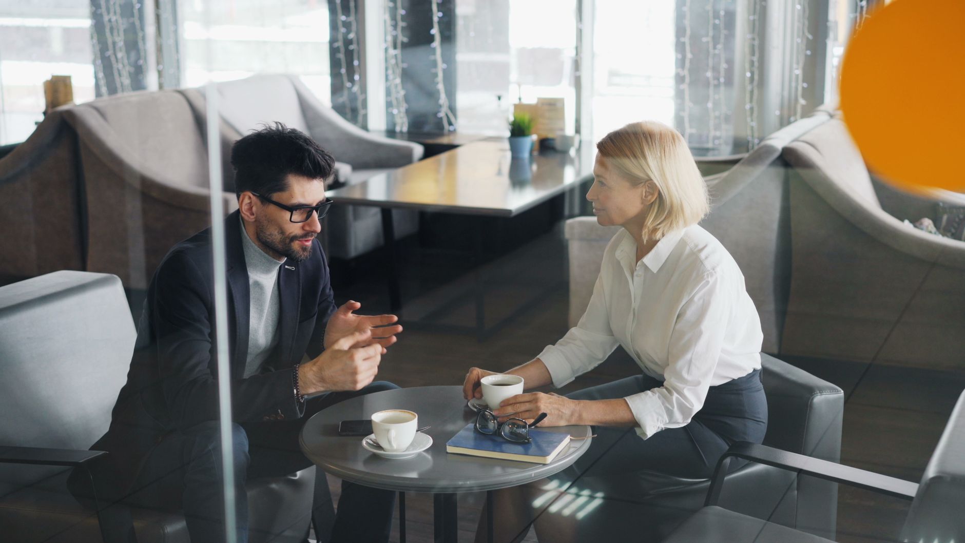 A consultant meeting a prospective client for an early conversation