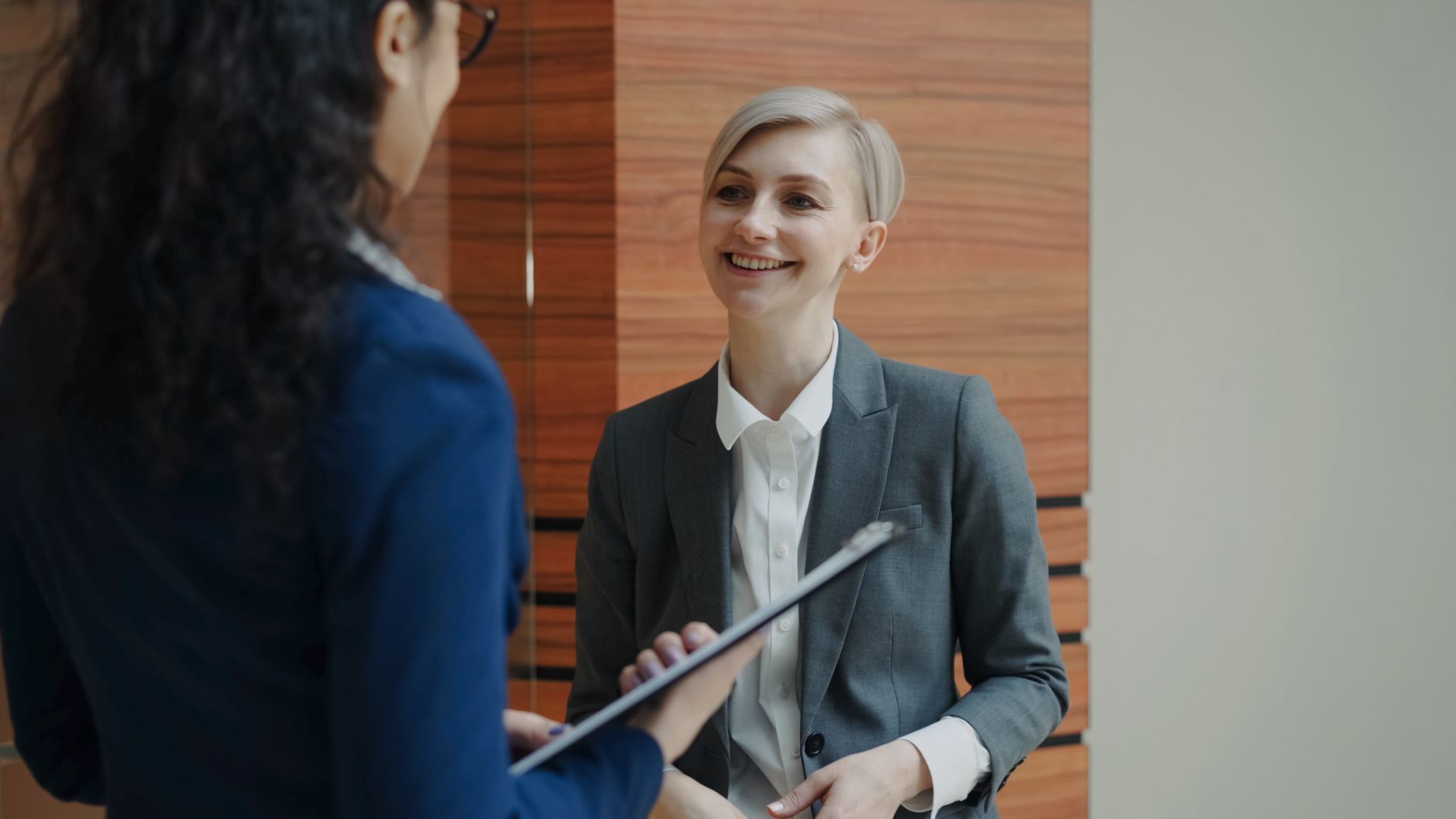An HR consultant meeting a manufacturing client on site