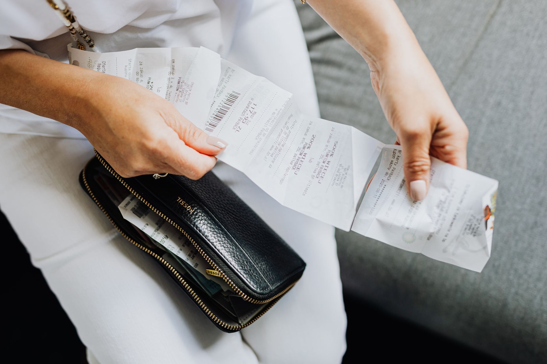 A parent going through a back-to-school budget and shopping list