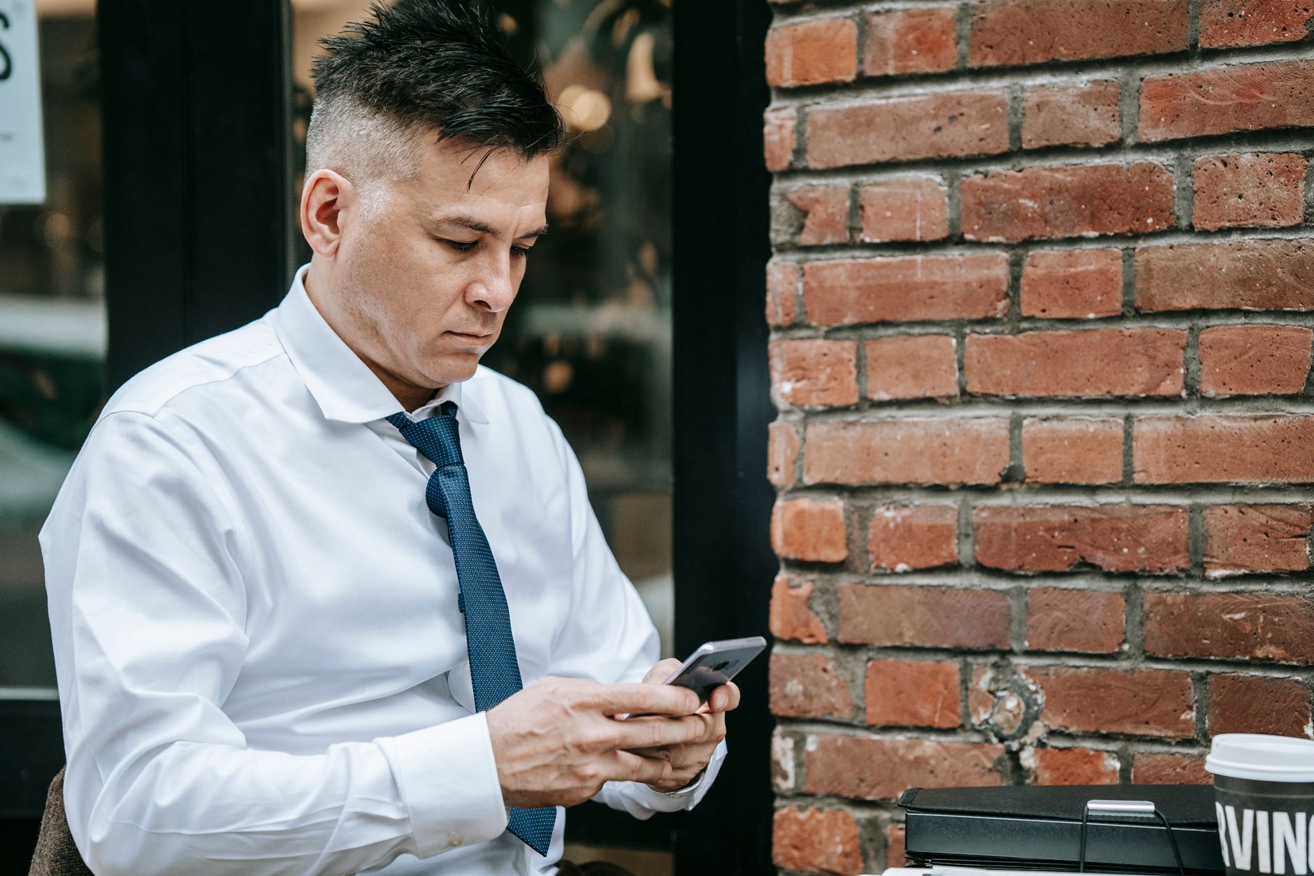 A client leaving a review on their phone after a salon visit