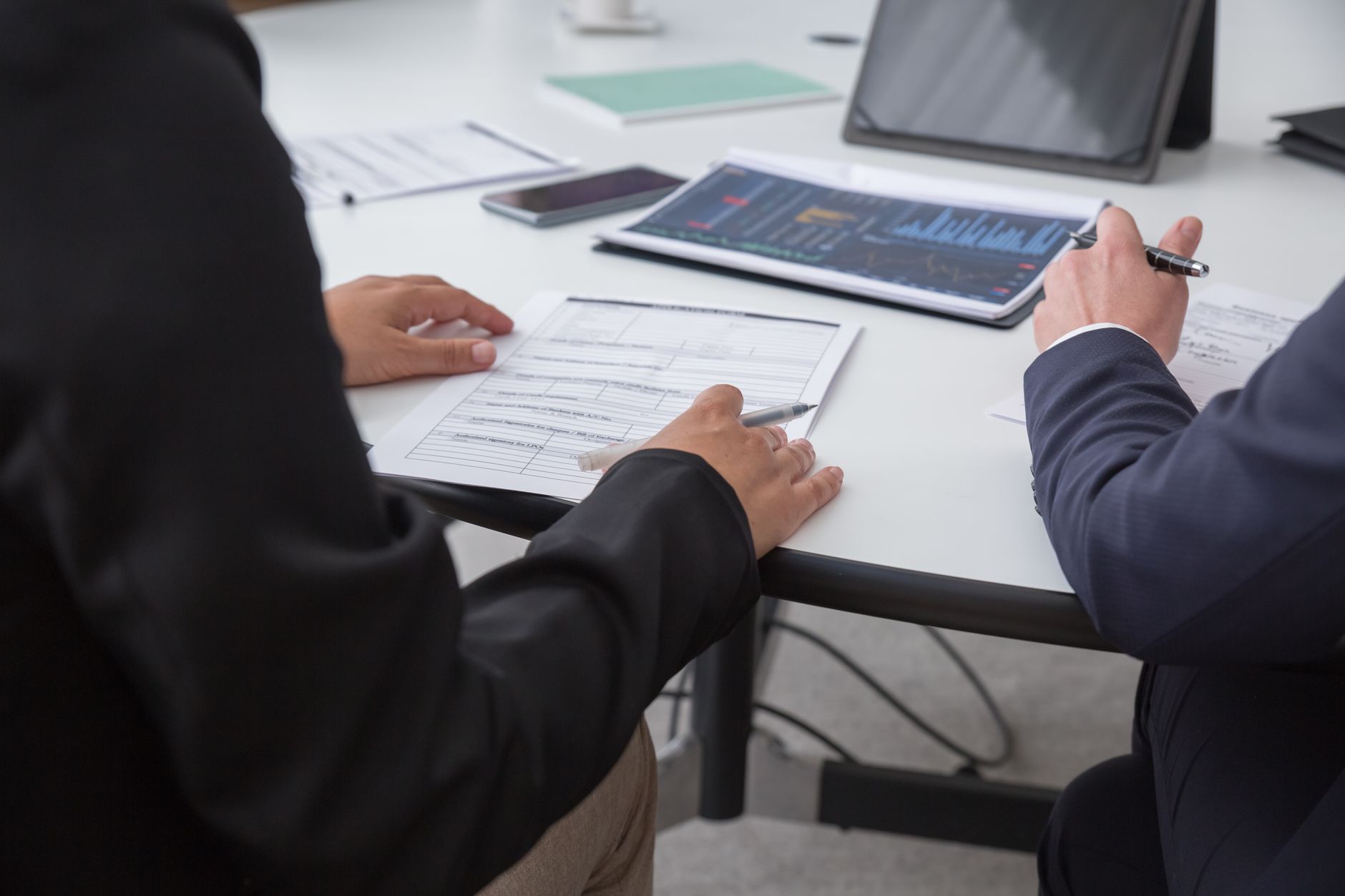 An owner researching competitors before setting a marketing plan