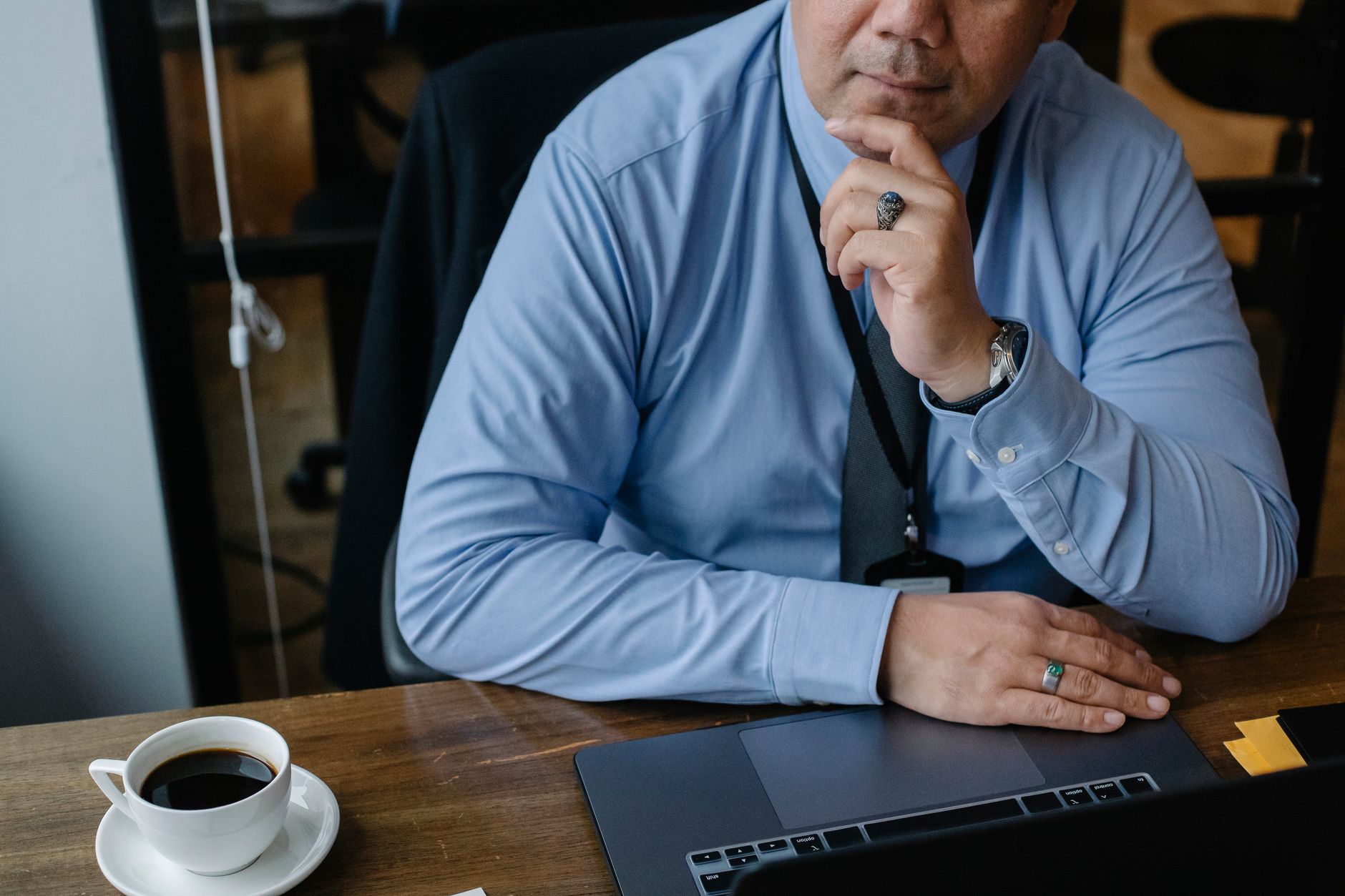 A small business owner weighing up marketing tools at their desk