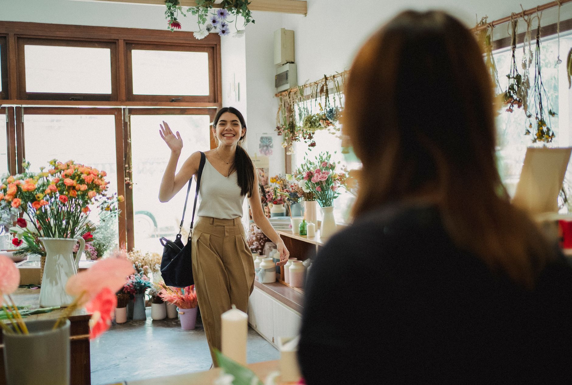 A person recognising a familiar face amid a crowded market