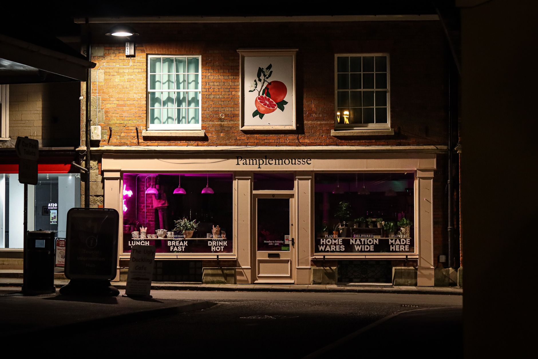 A row of independent shopfronts on a recovering UK high street