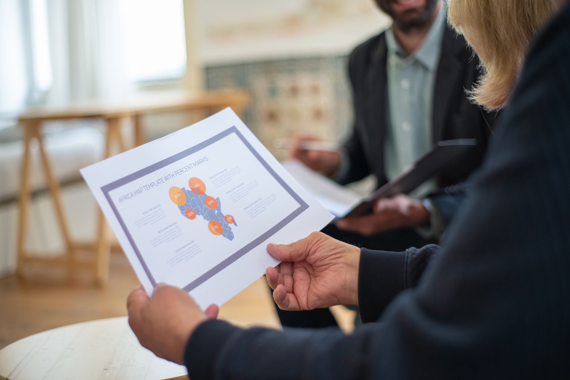 A studio owner presenting finished brand guidelines to a client