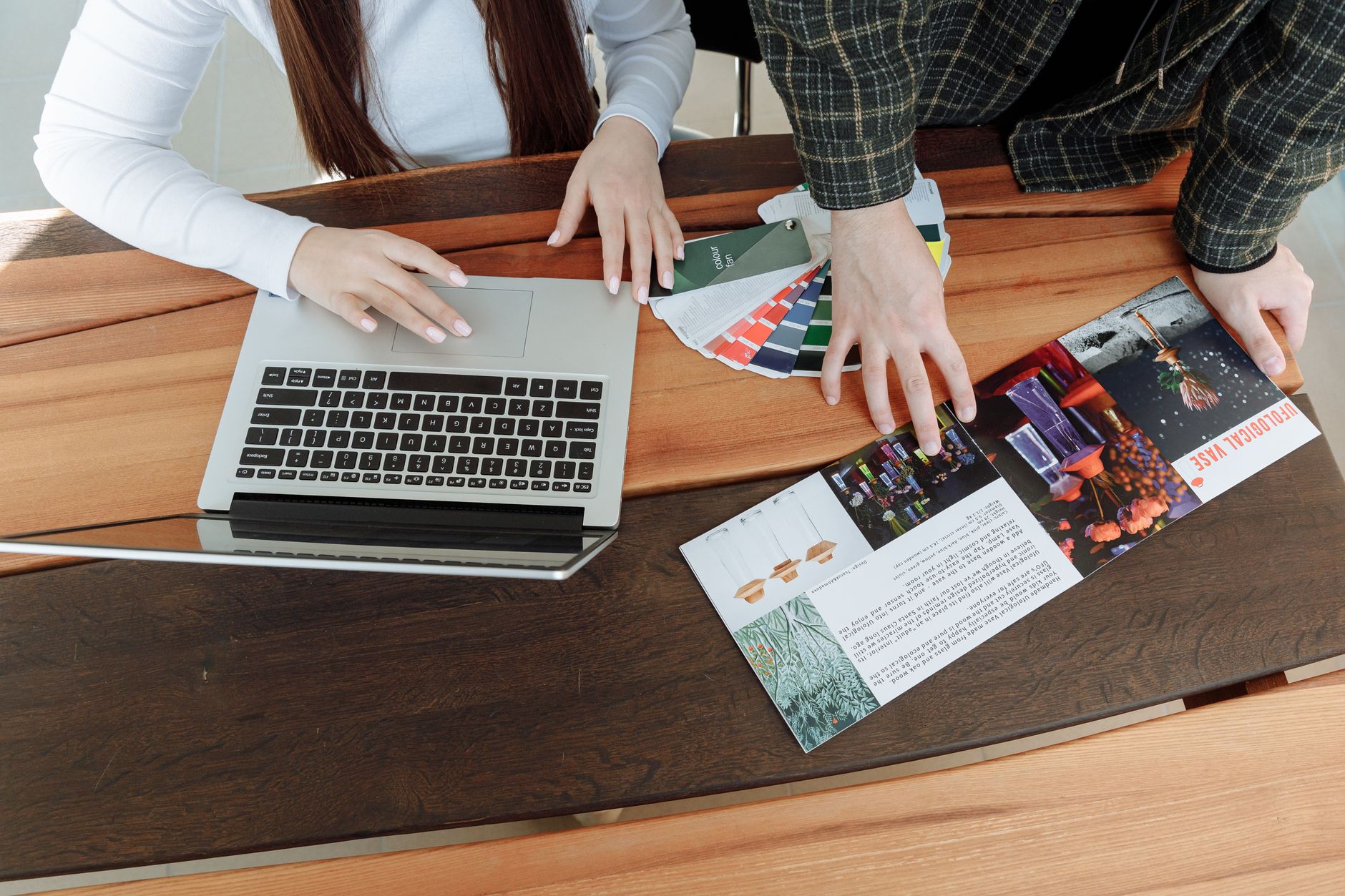 Two colleagues noticing their marketing materials tell different stories