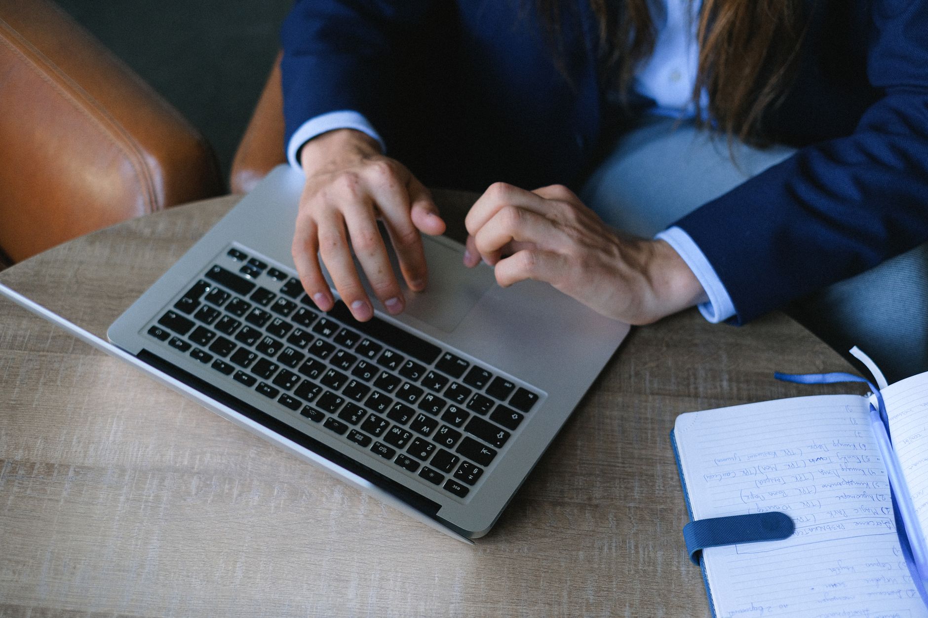A business owner researching software while working from a cafe