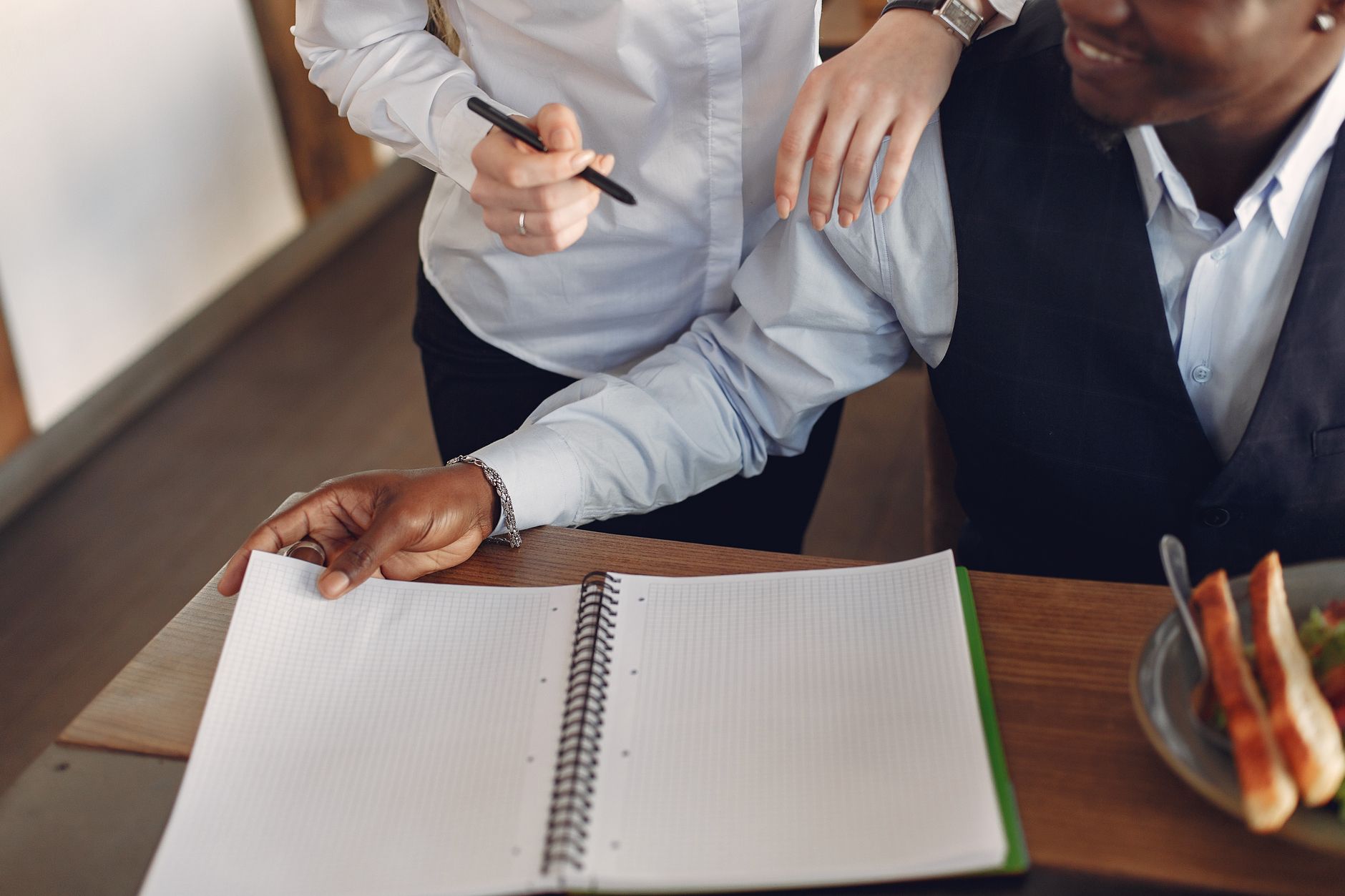 Two colleagues separating brand strategy from campaign activity