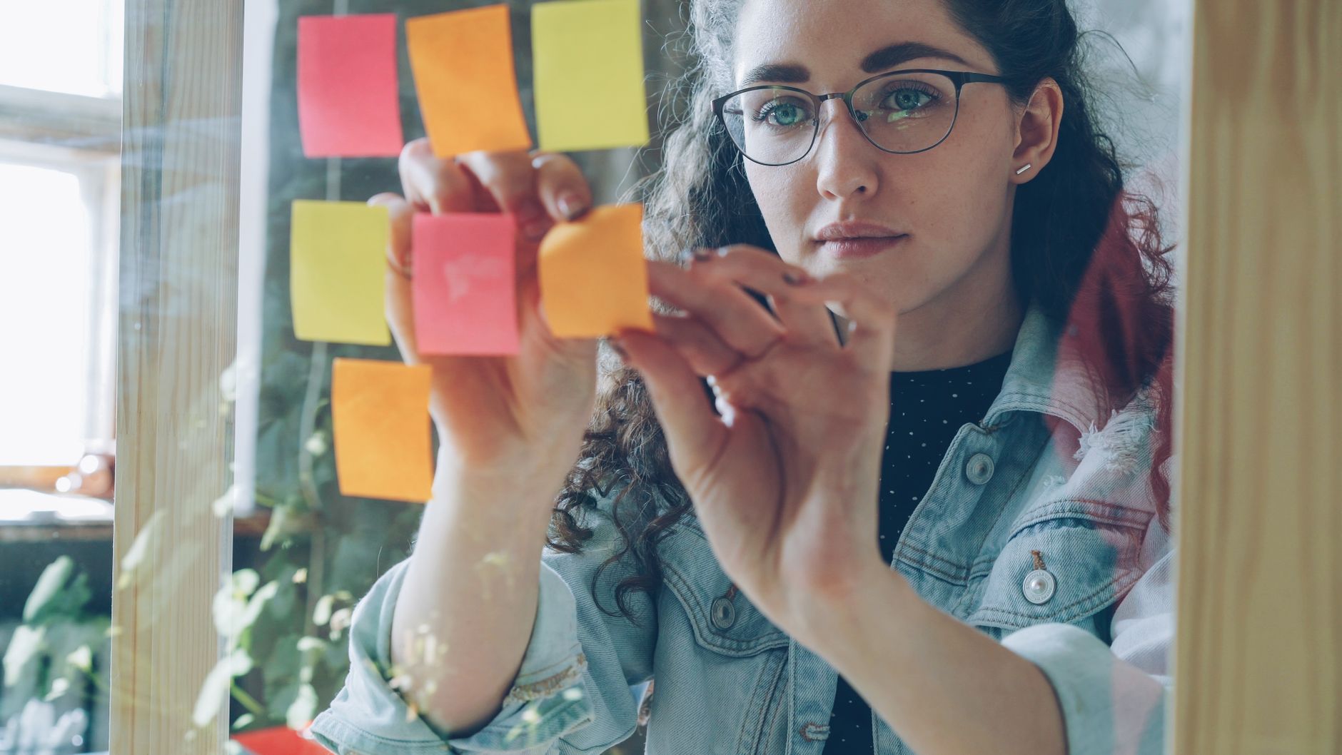 An owner building a brand strategy step by step with notes