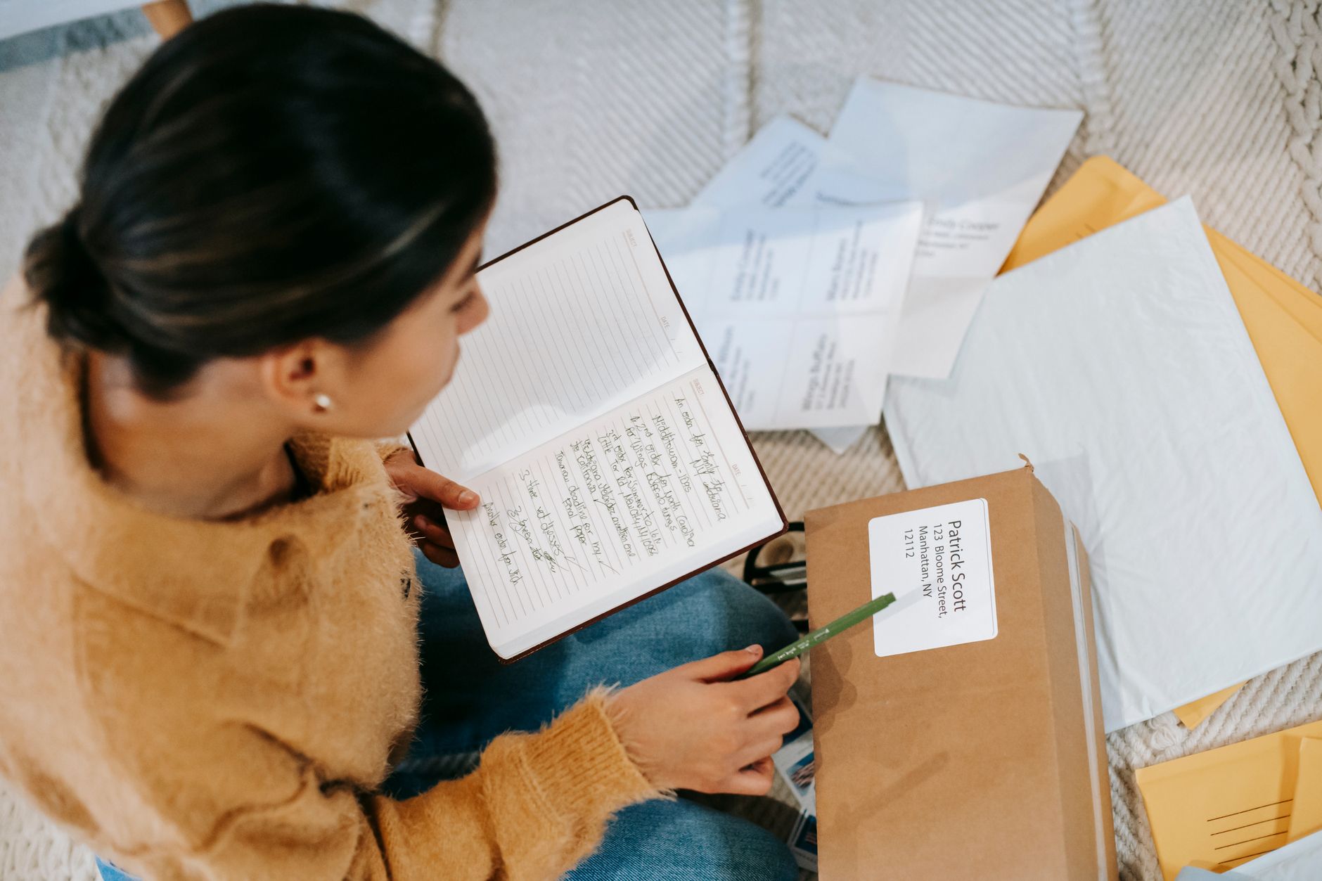 A potter writing a personal note to include with an order