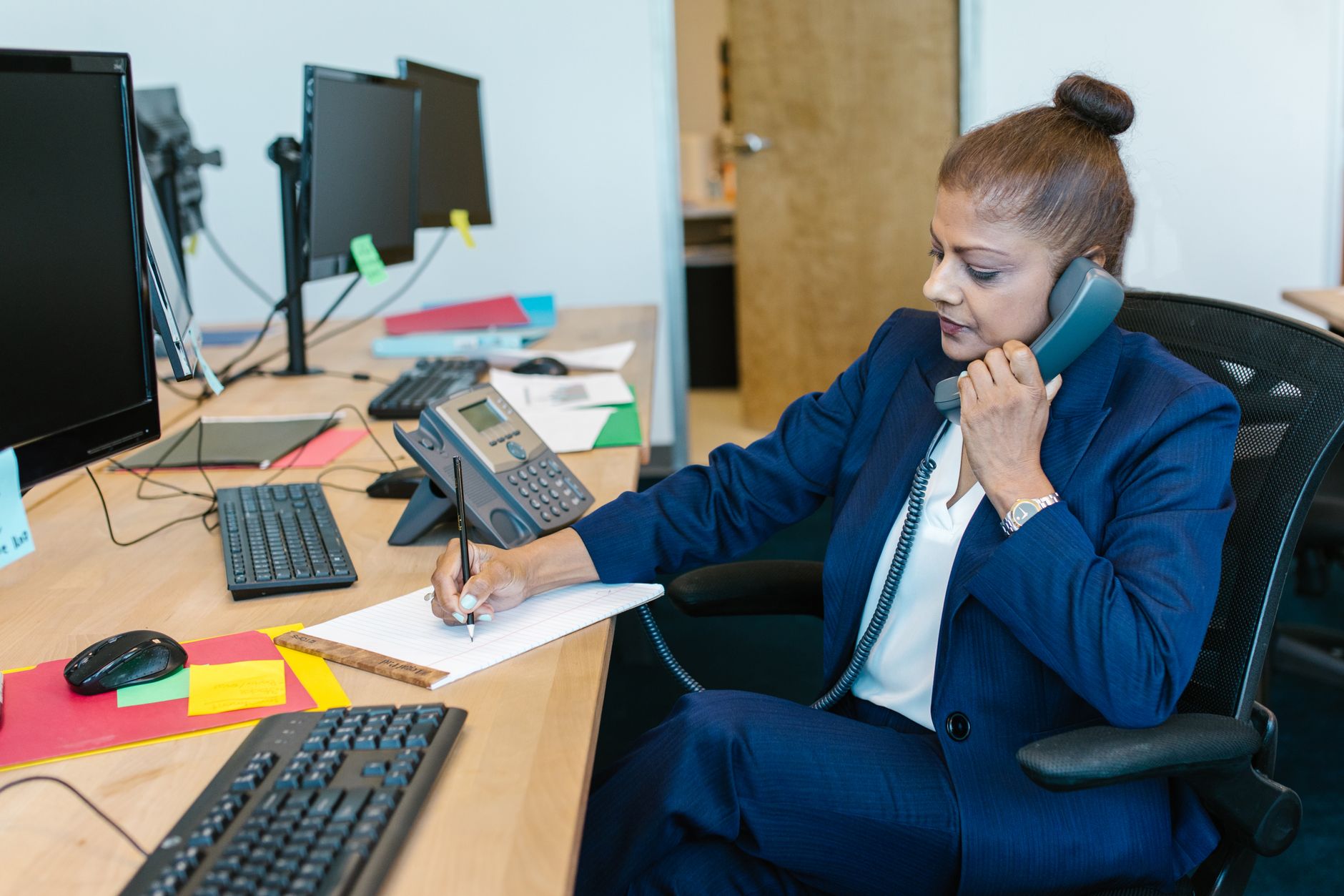 A business owner listening carefully to a customer's needs on a call