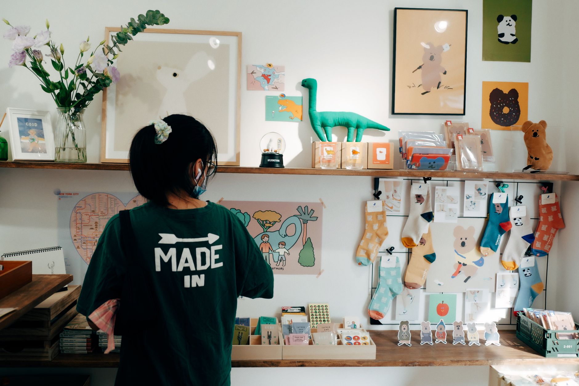 A shop assistant pricing and labelling Christmas gift items