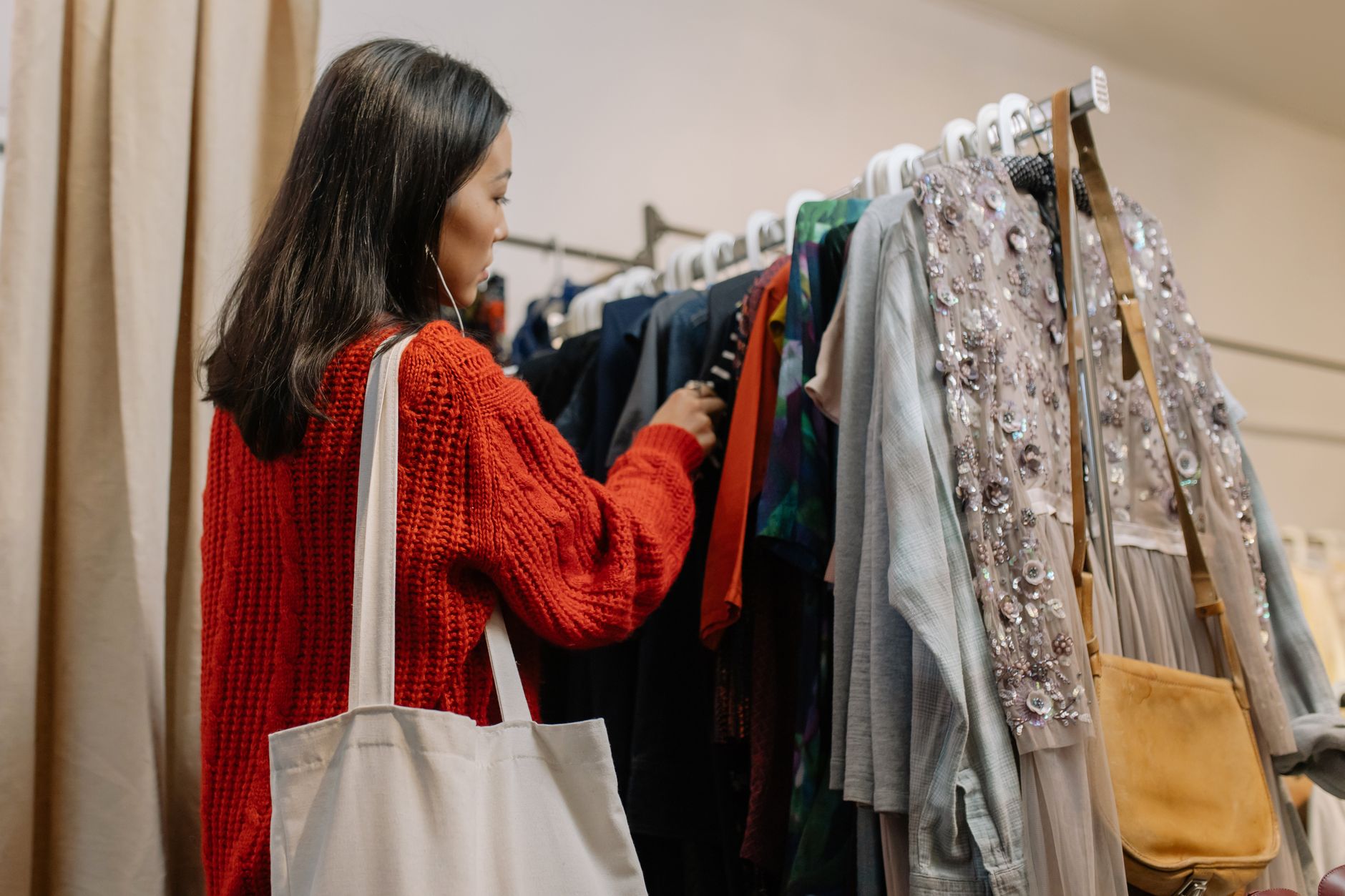A customer browsing Black Friday offers in a small shop