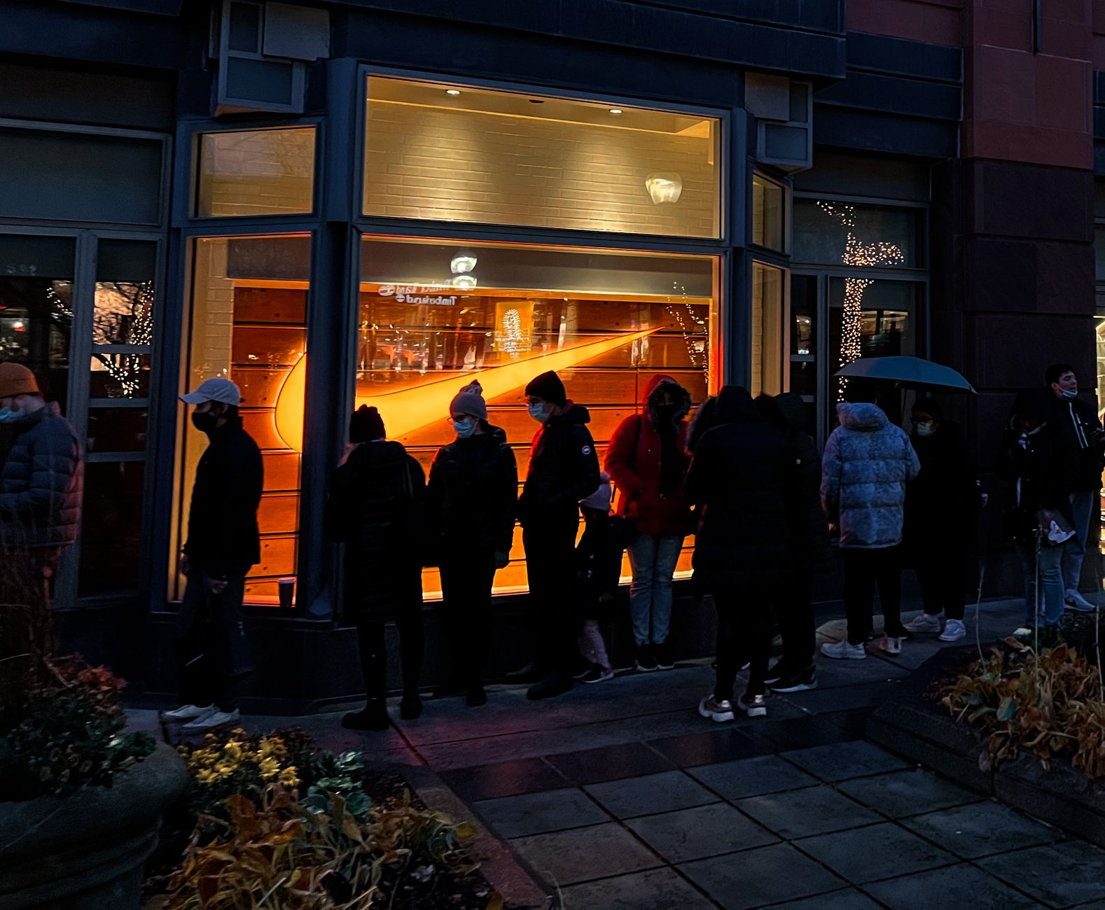 Shoppers queuing outside an independent shop on Black Friday