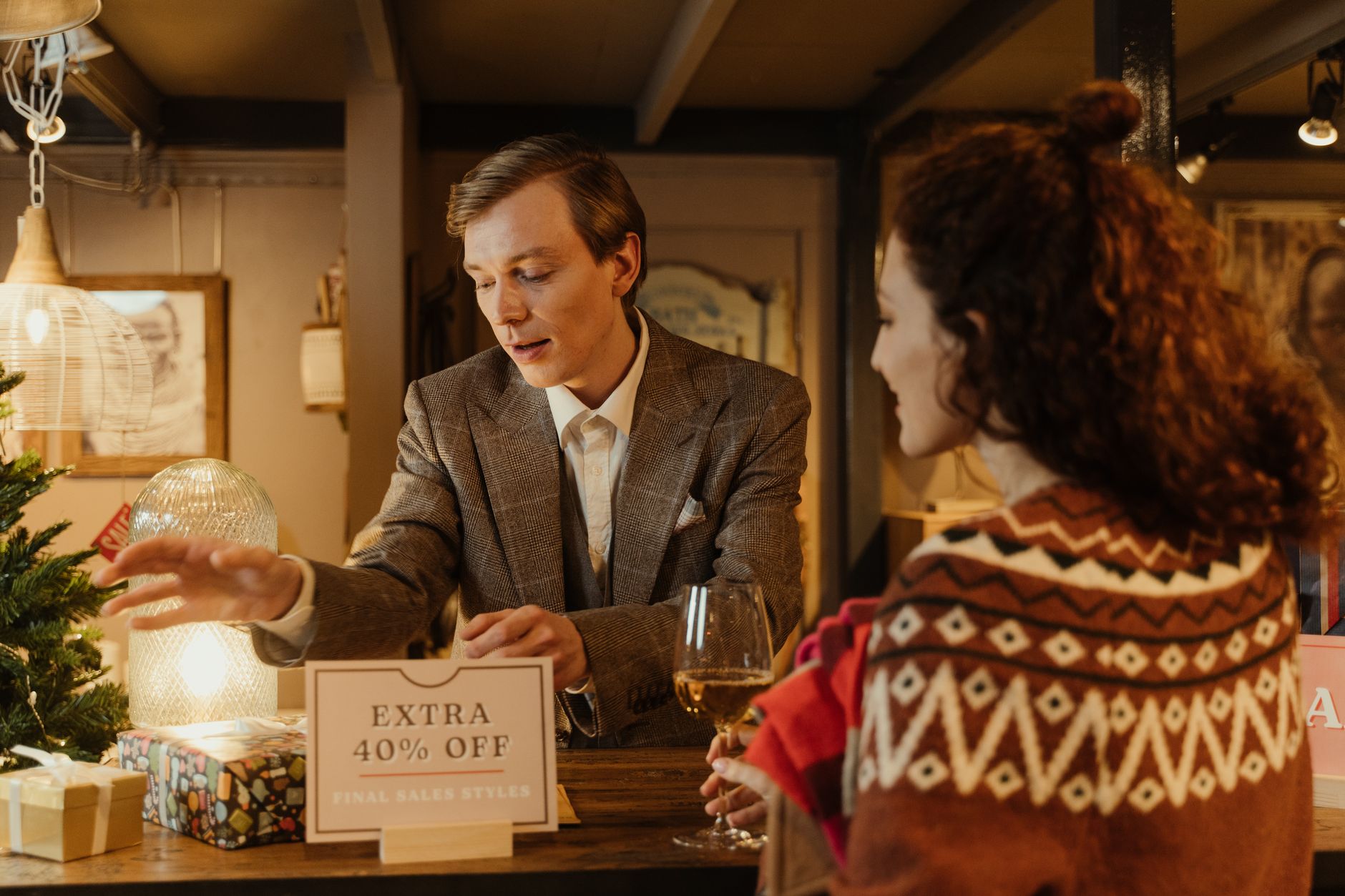 Two gift shop owners planning their seasonal display together