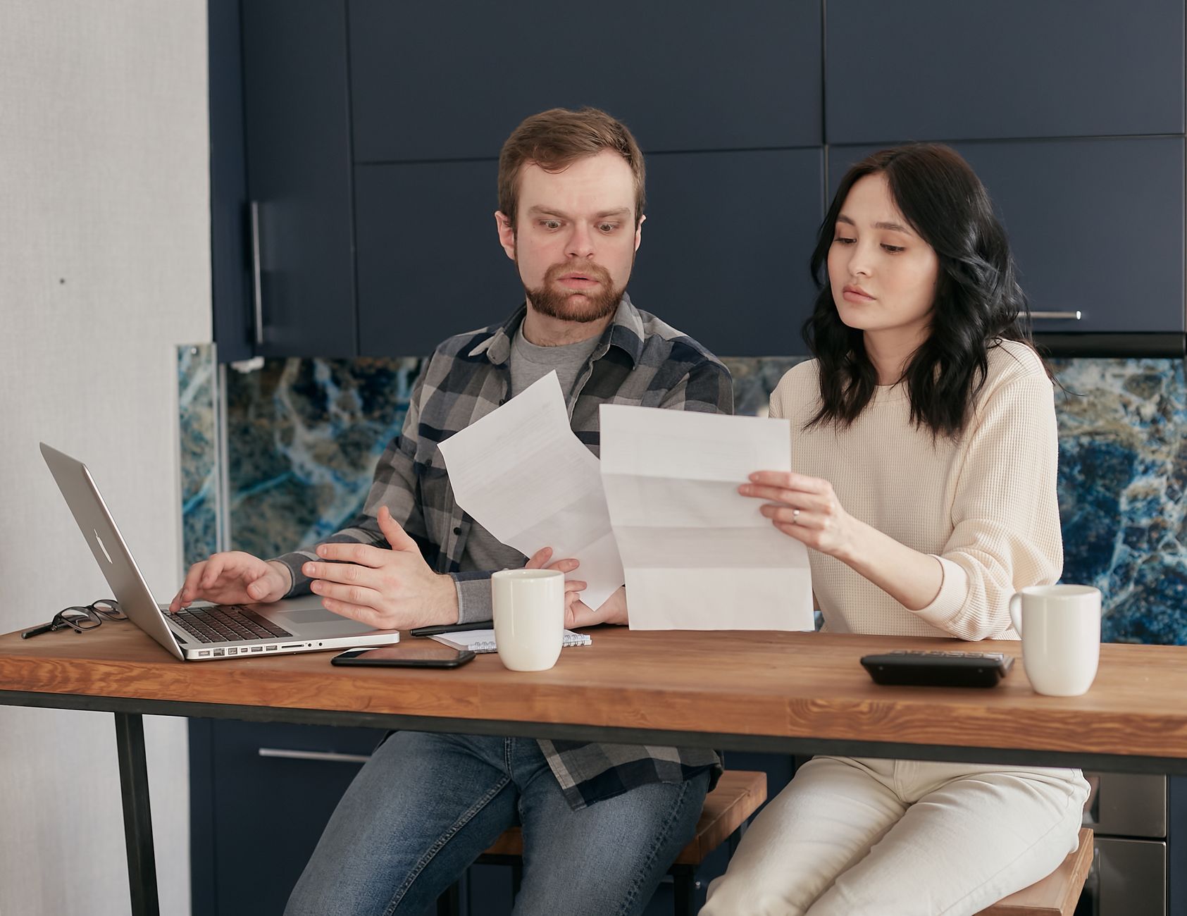 An owner reviewing their shop's monthly performance figures