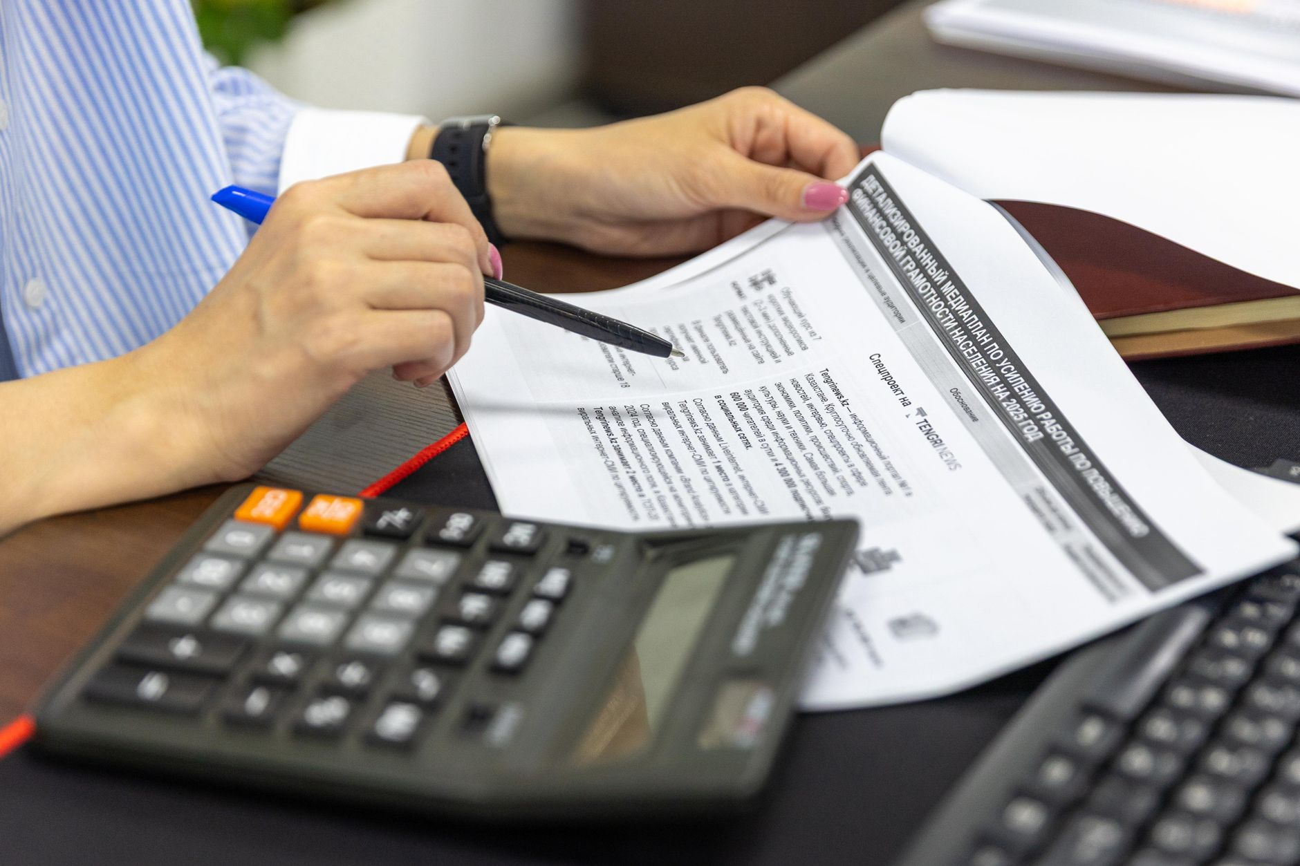 A small business owner working out the cost of acquiring a new customer