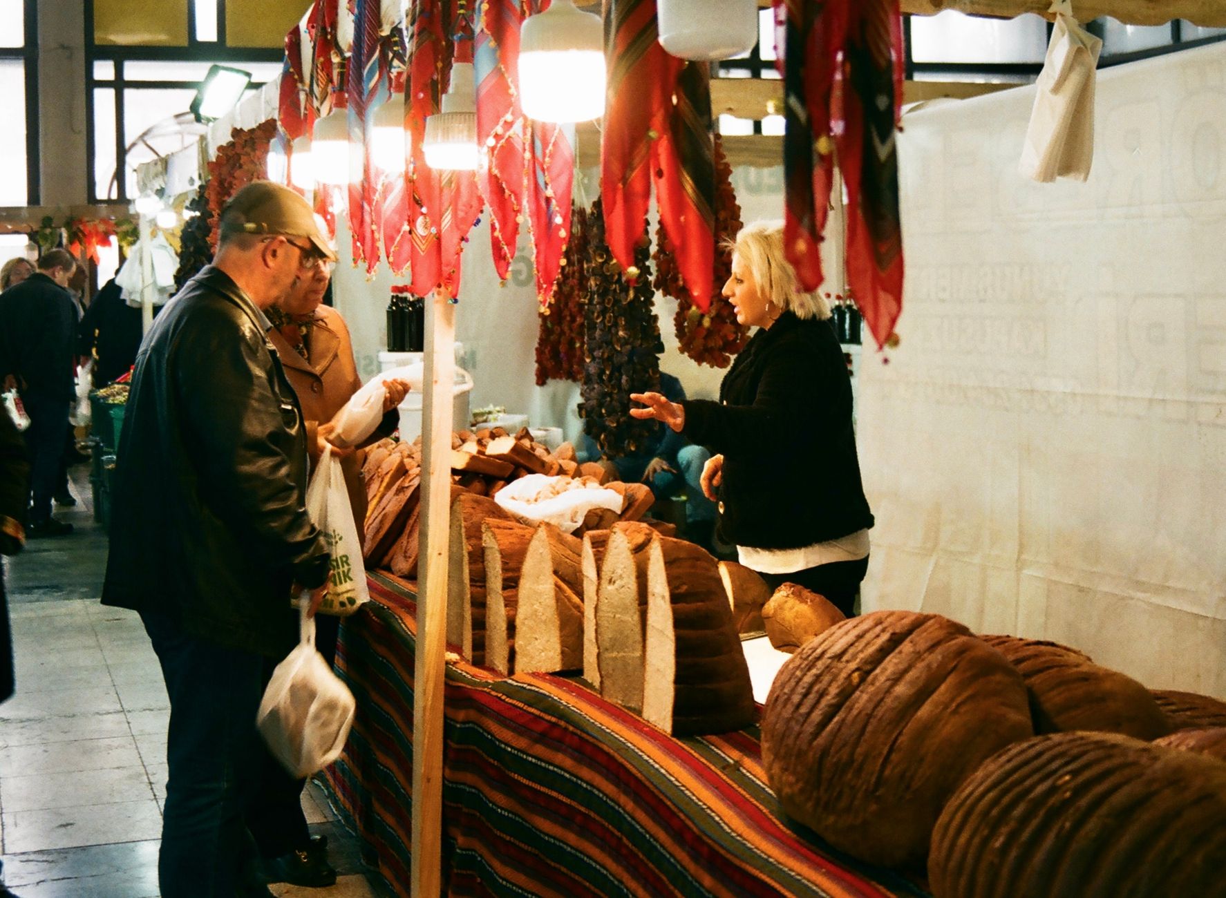 A shop owner greeting a customer who has bought from them several times