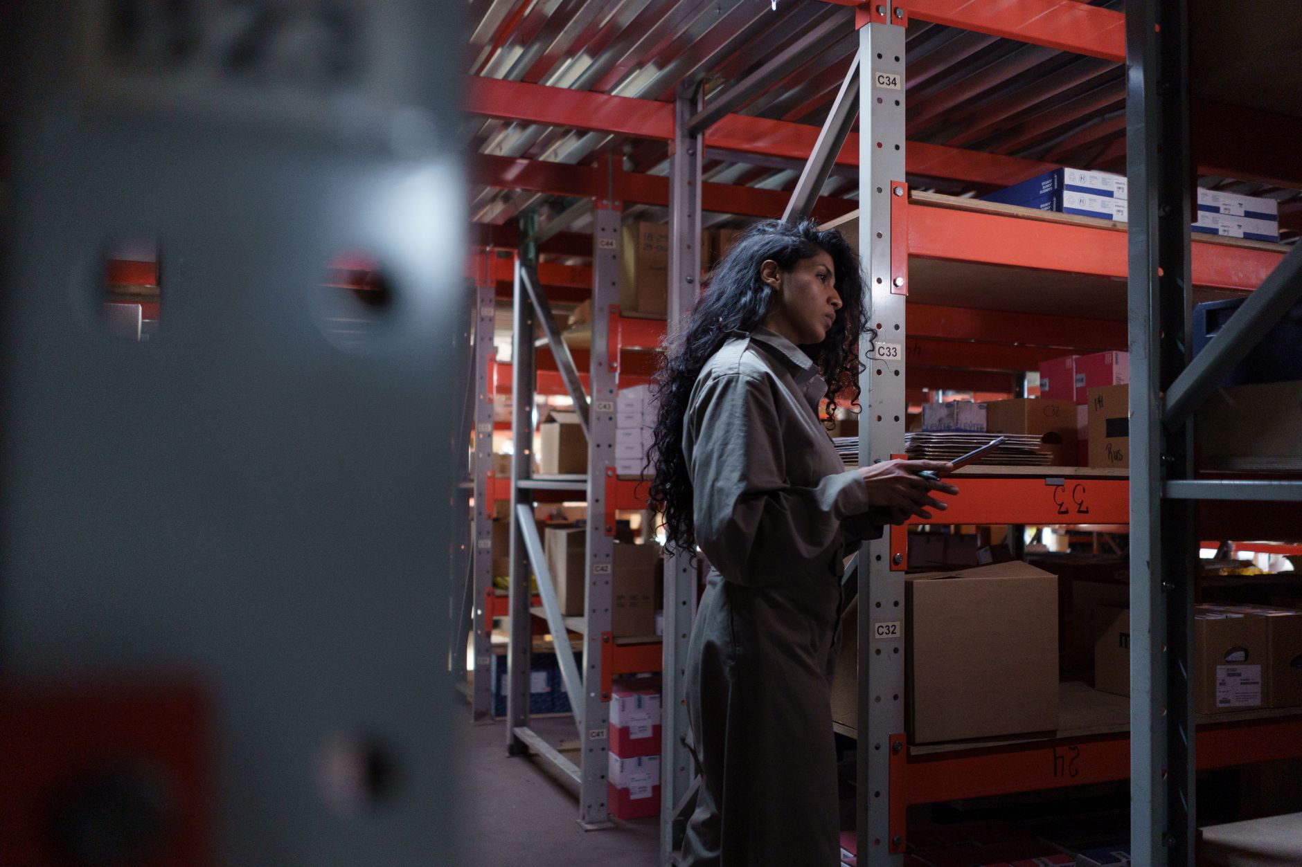 A shop owner checking stock before deciding on a Cyber Monday offer