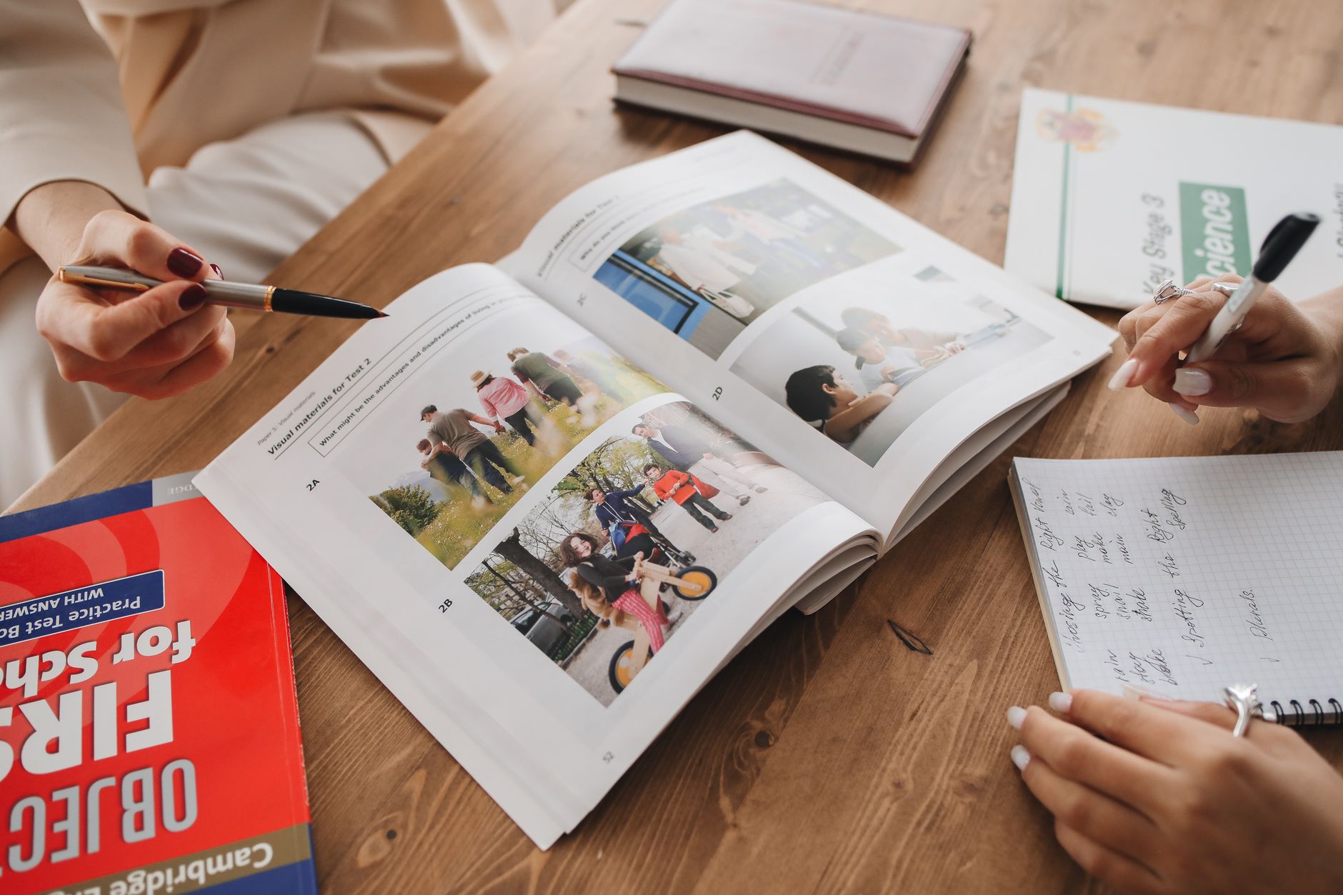 A tutor going through course materials with a student