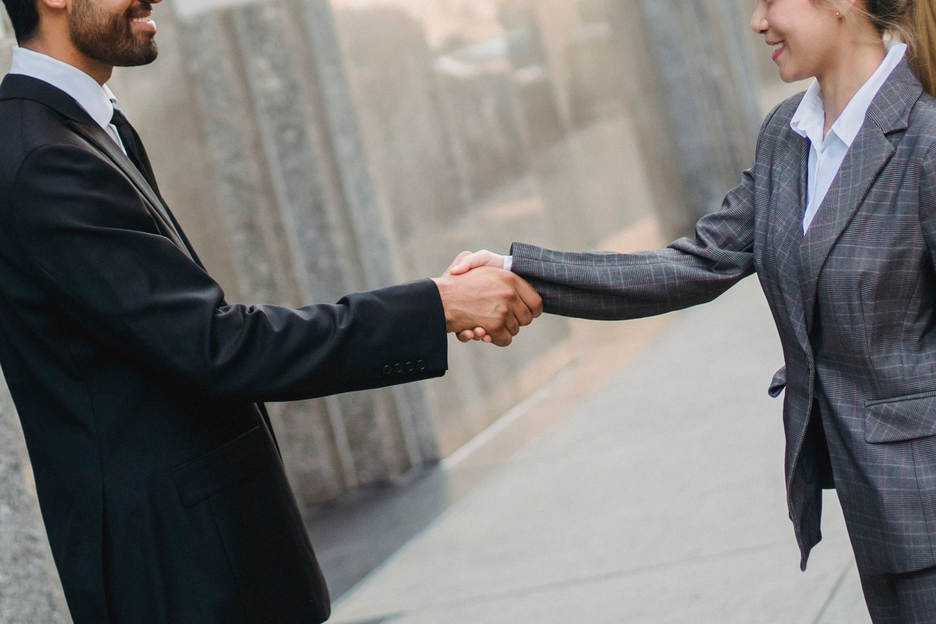 Two people meeting for the first time at a small business event