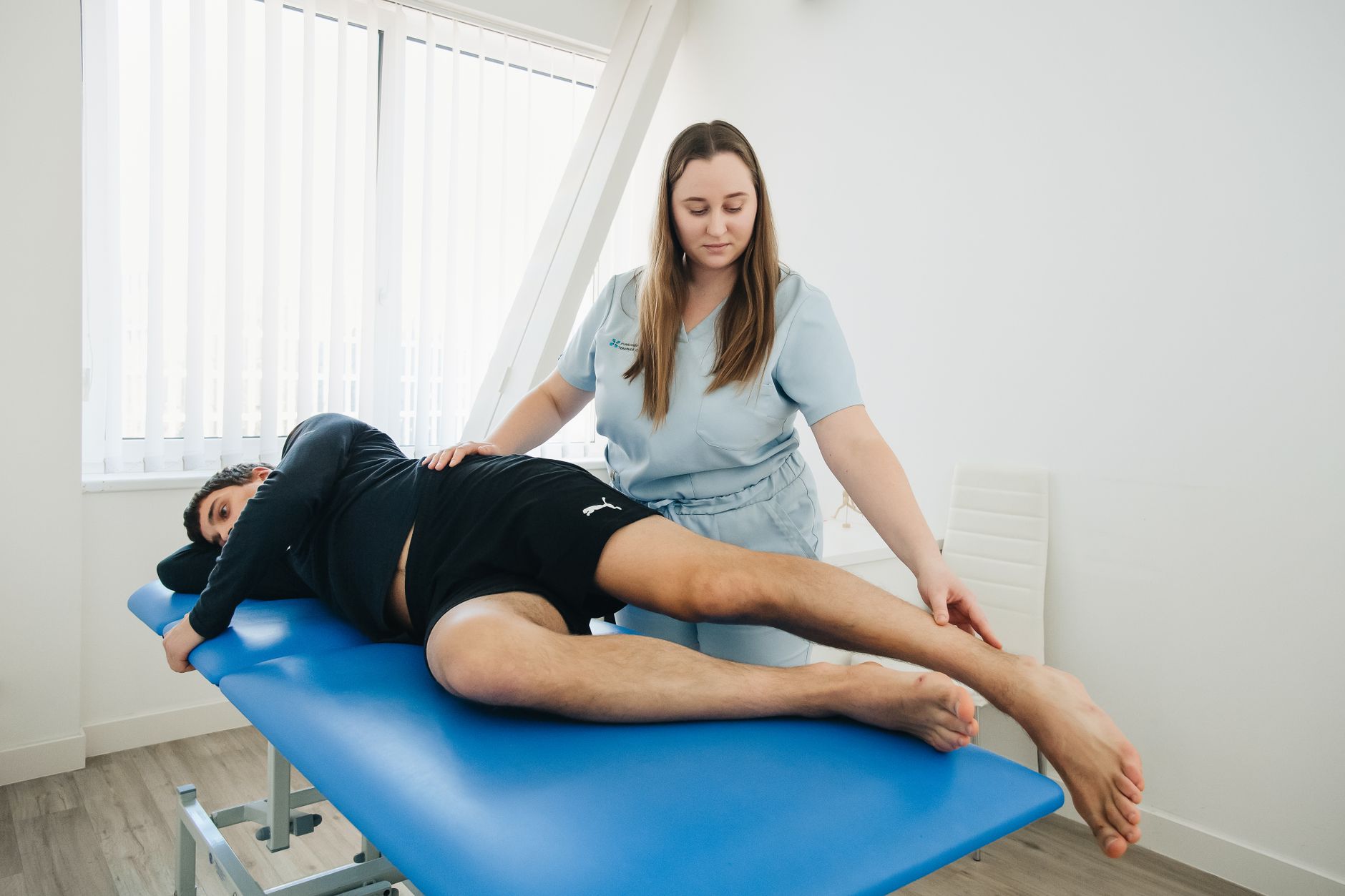 A physiotherapist explaining their approach to a client