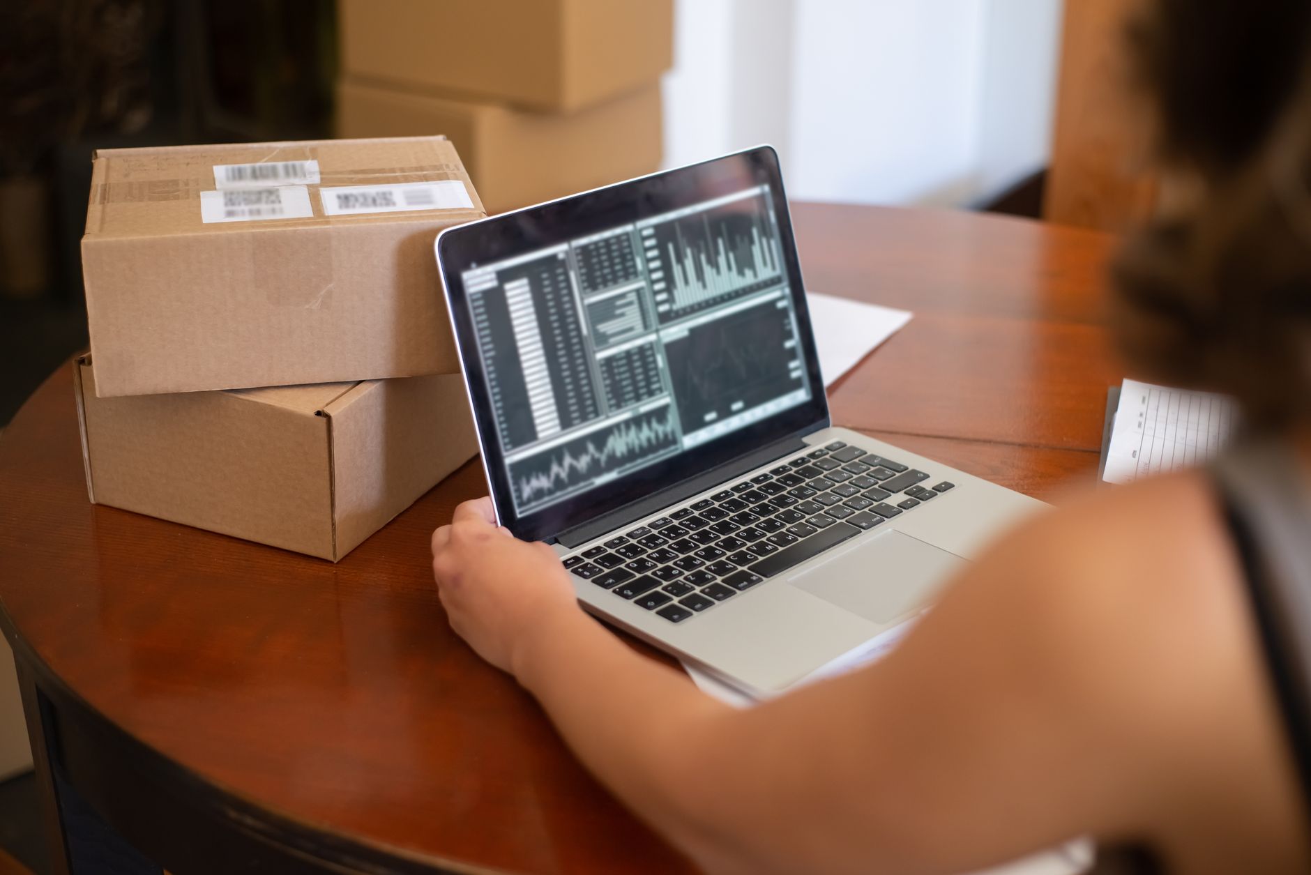 A small business owner checking a new order confirmation