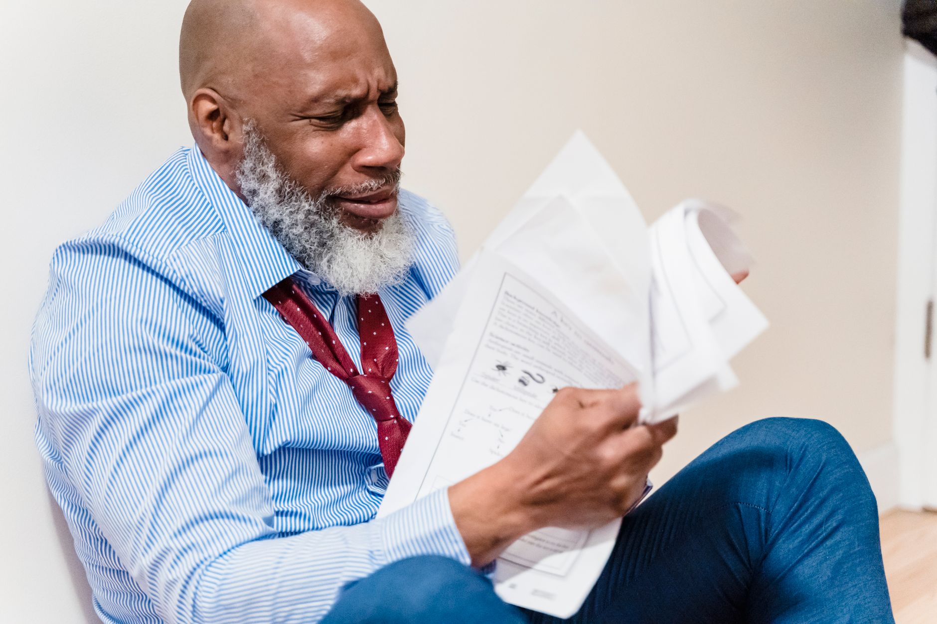 A business owner reviewing disappointing sales figures at a desk