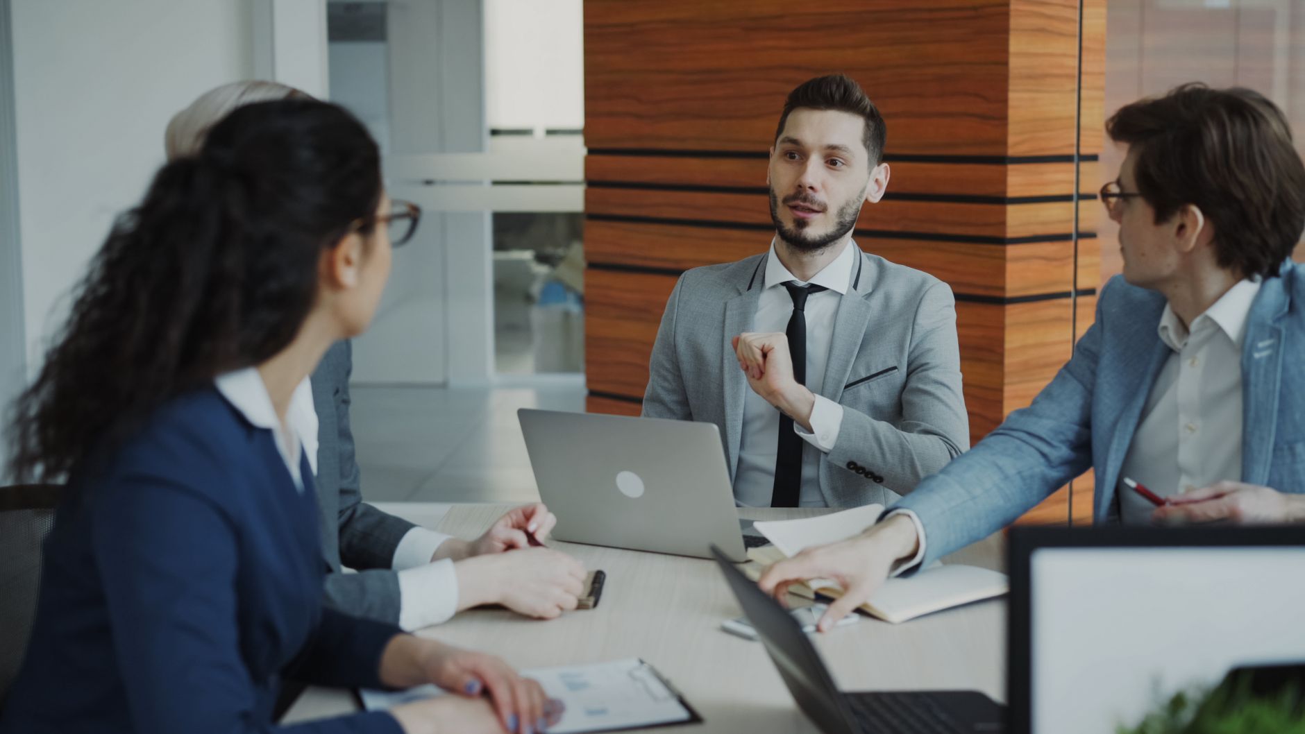 Two colleagues weighing up two different email subject lines