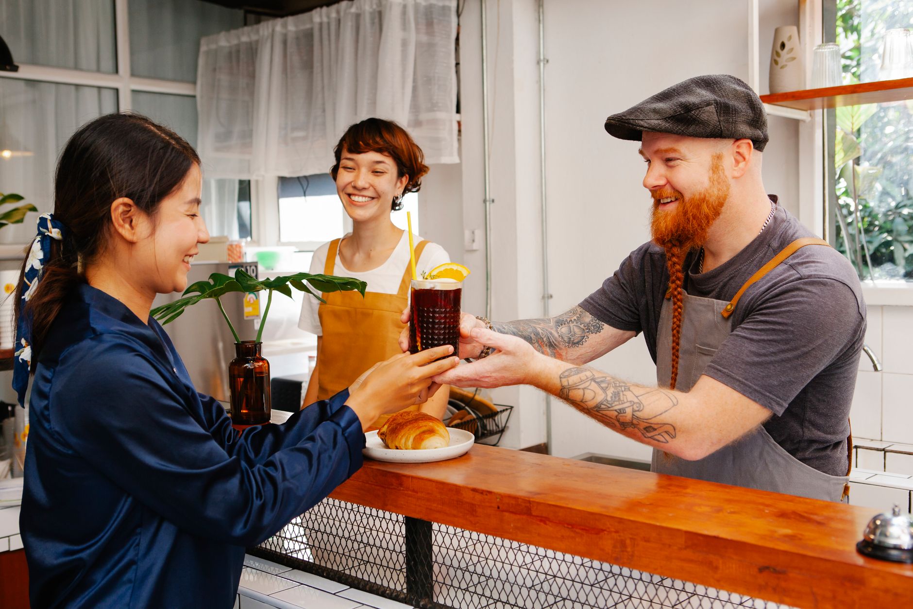 A cafe owner earning loyalty one customer at a time