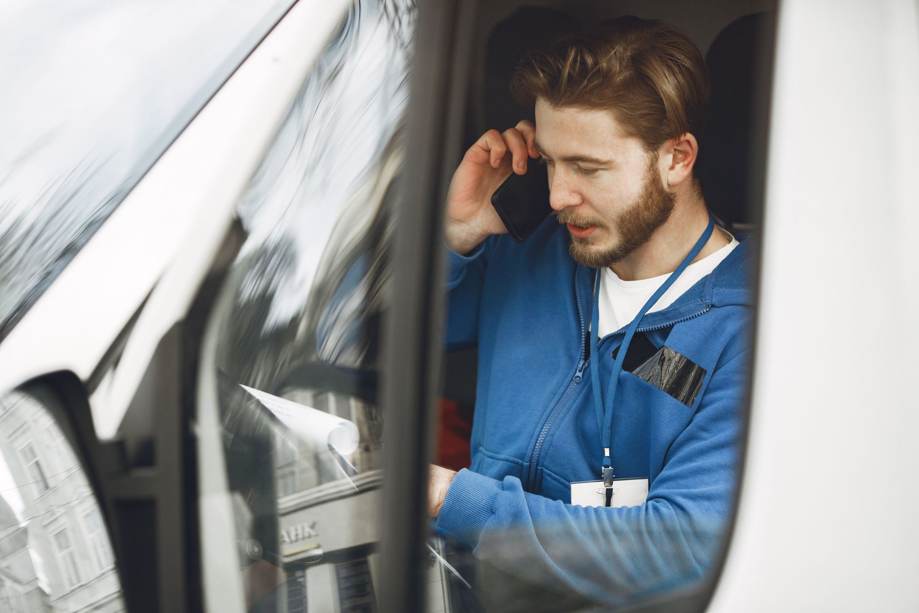 A locksmith taking a call from a local customer