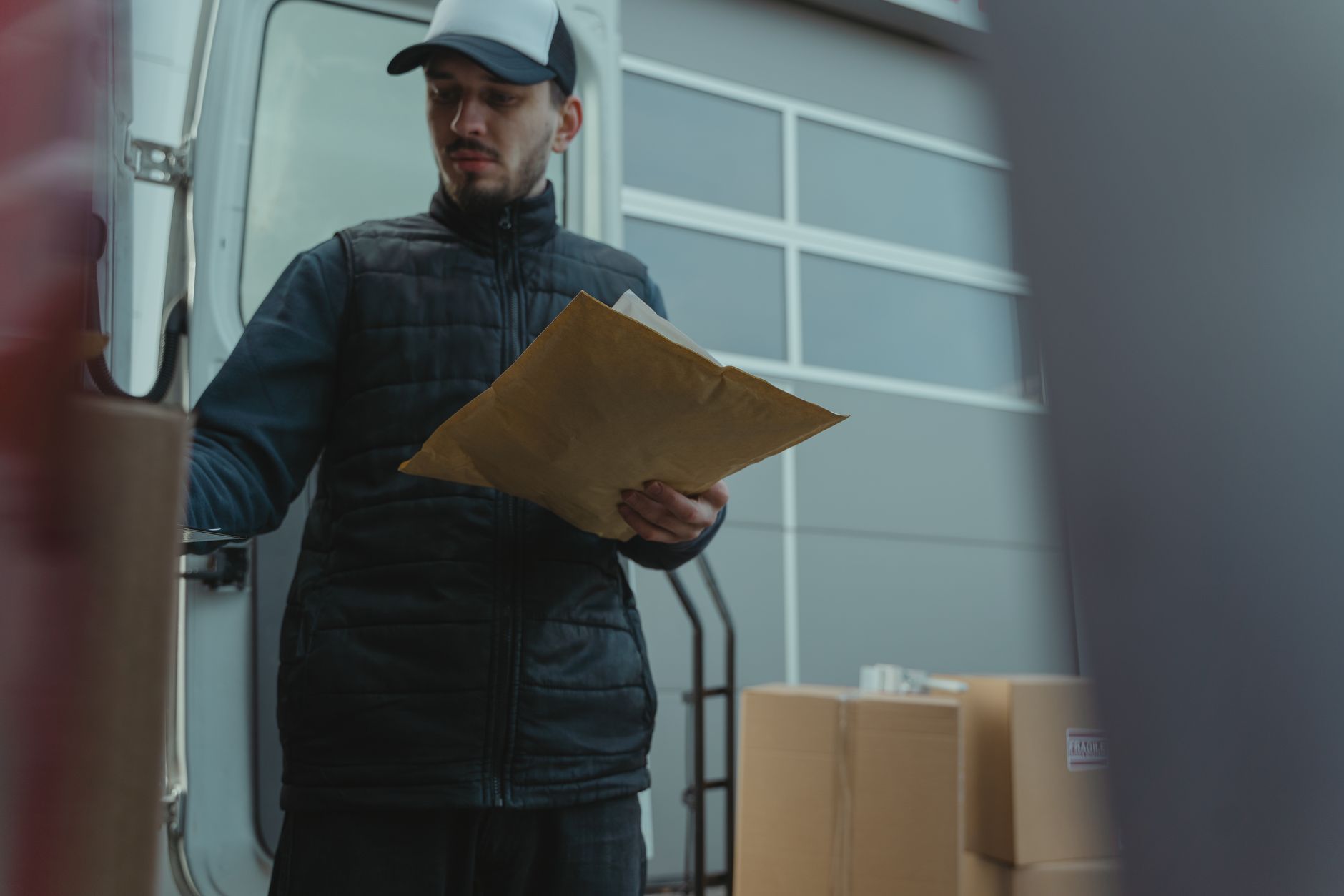 A postal delivery arriving at a small business premises