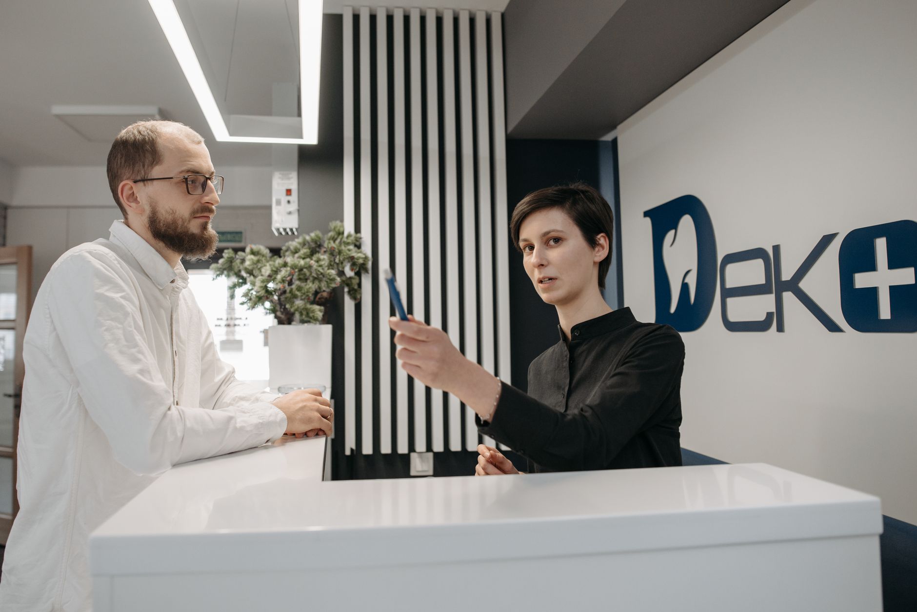 A dental receptionist keeping appointment information accurate and current