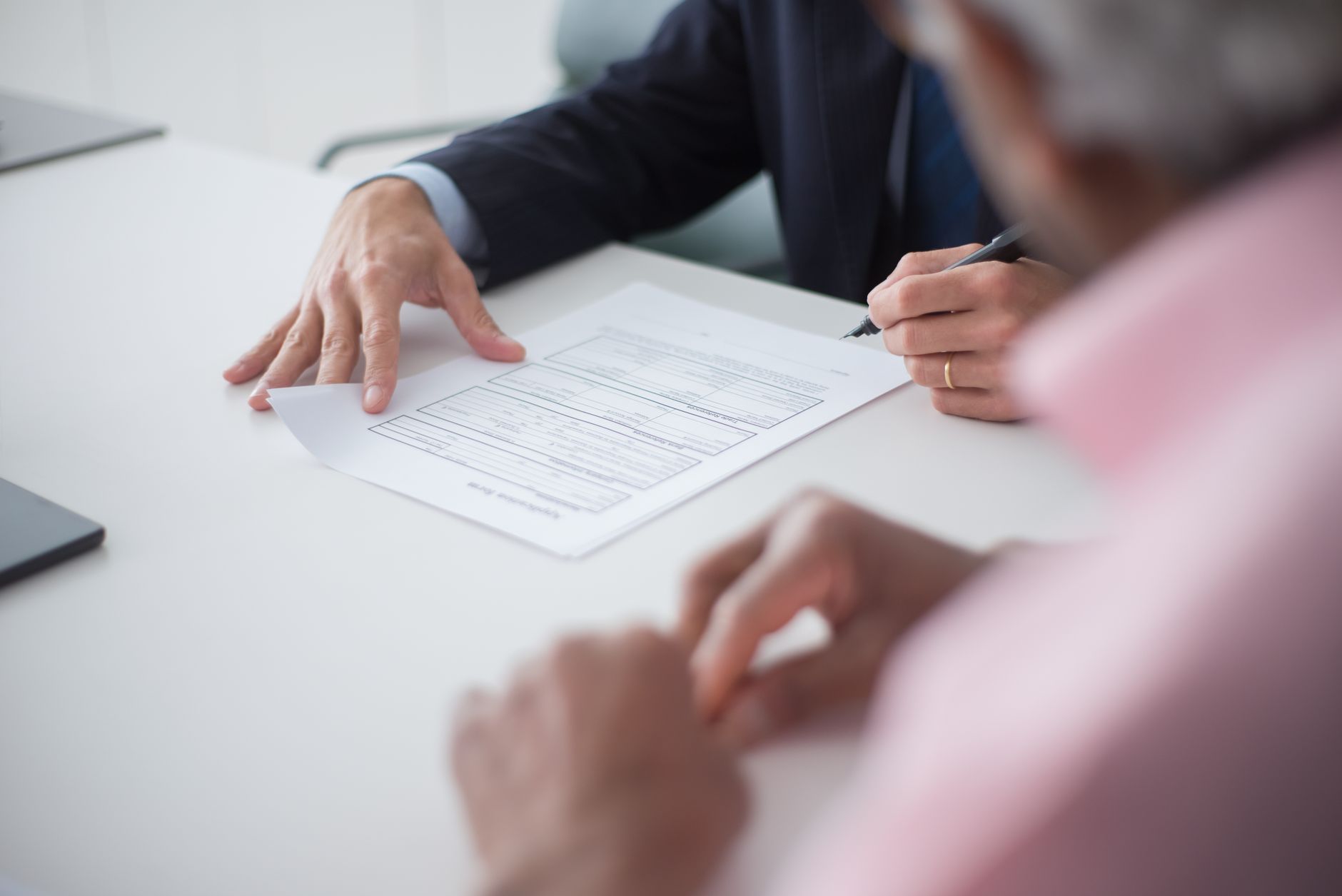 A consultant talking a client through next steps on a contract