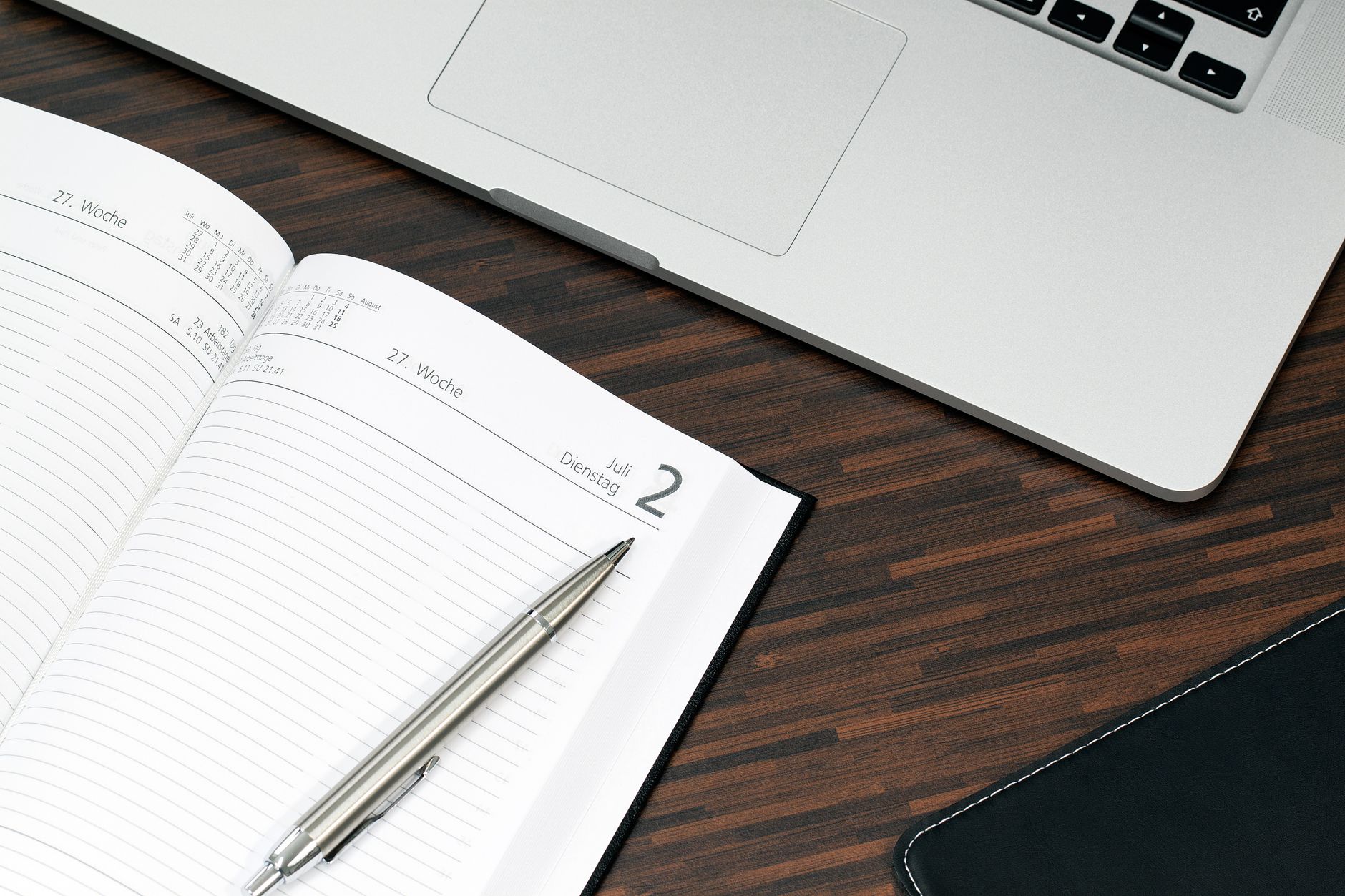 A client books a massage appointment on a laptop, choosing an available time slot from a clean online calendar.