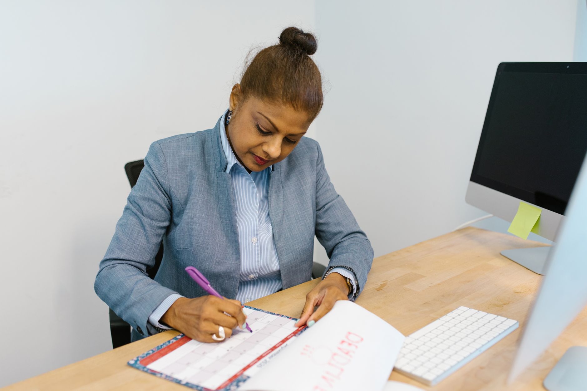 An owner reviewing monthly booking numbers at their desk