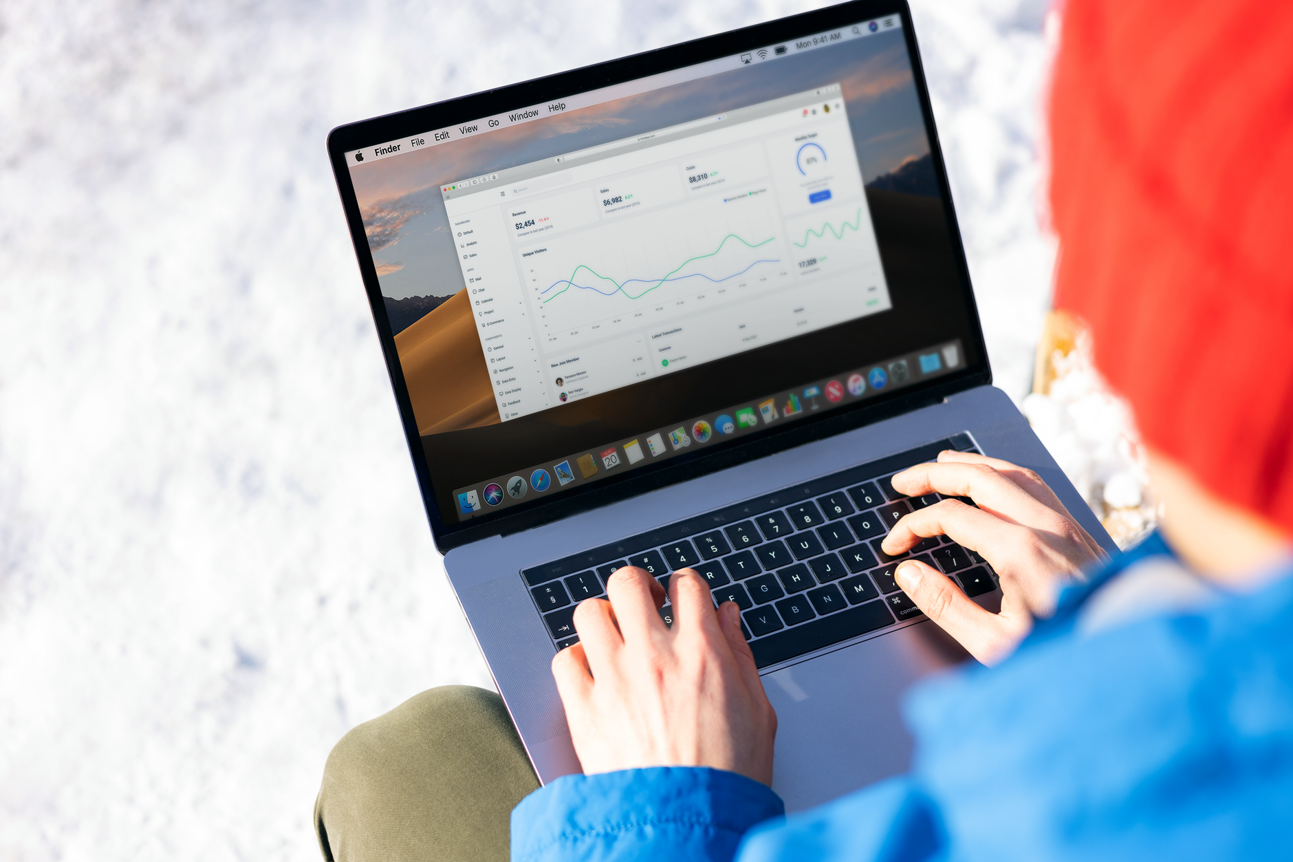 Hands at a laptop on a desk working through a business profile dashboard to set up a review link